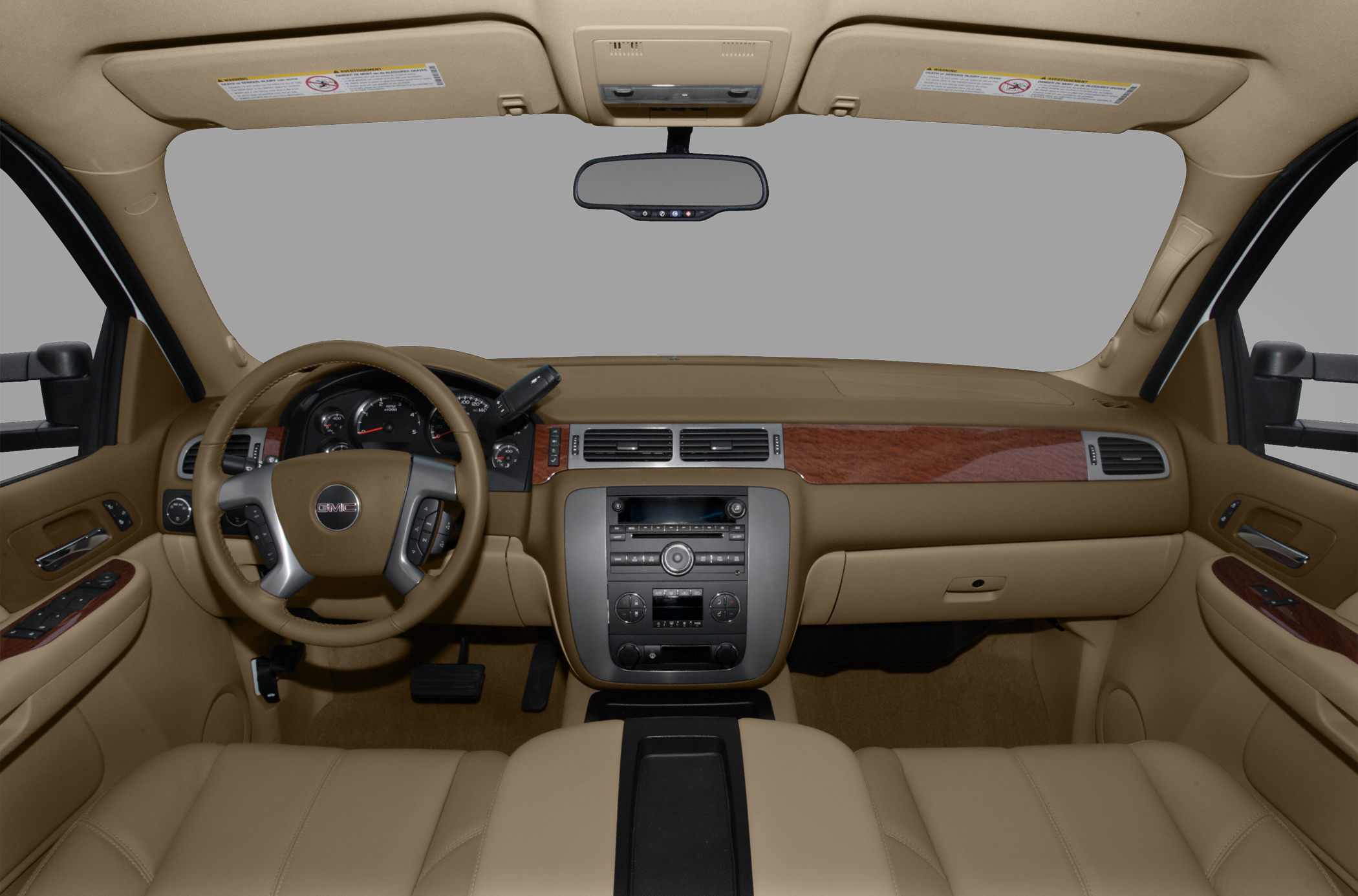 Dashboard, steering wheel, center console with wood trim and controls