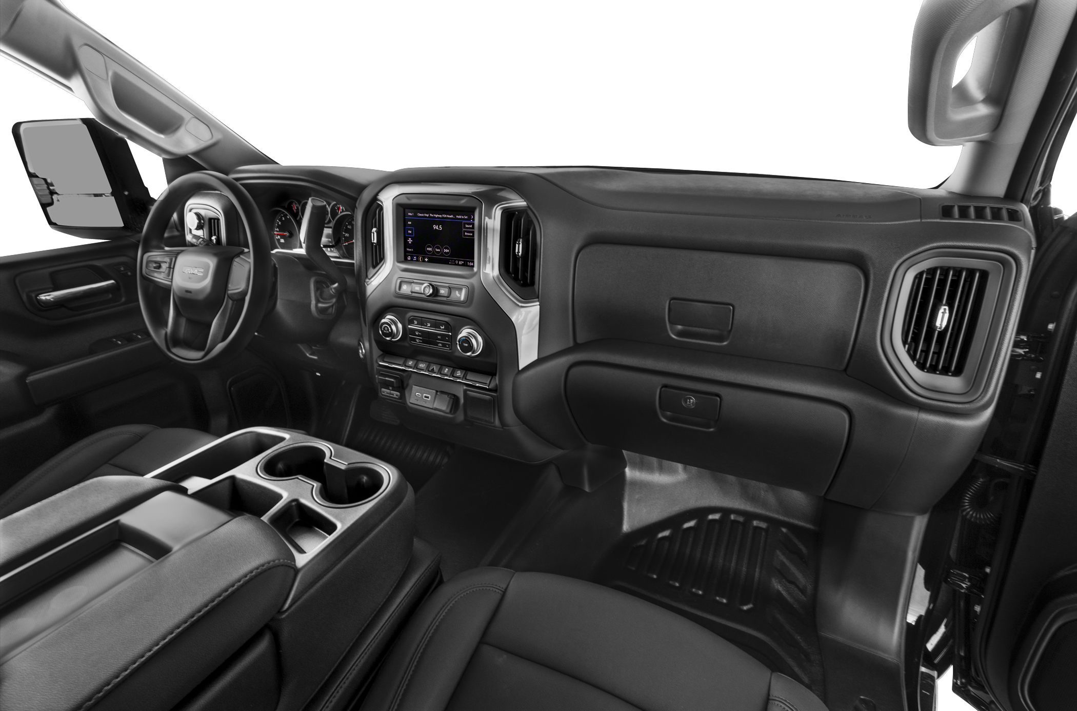 Modern truck dashboard and steering with operator controls and center console.