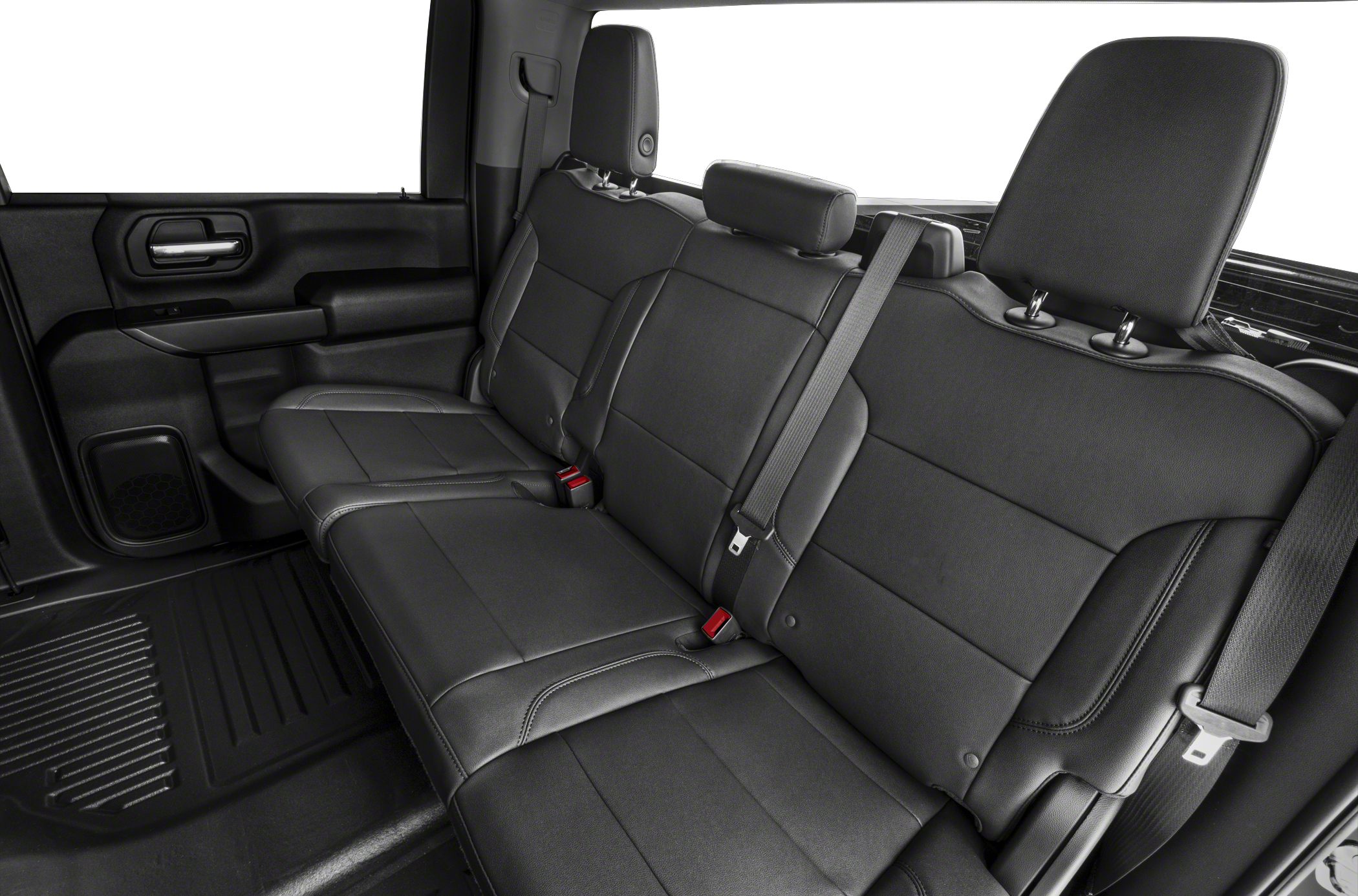 Spacious leather rear seating with seatbelts and headrests in truck interior