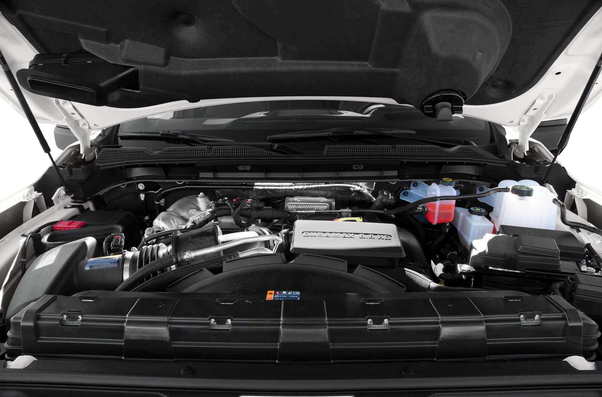 Engine bay with Duramax 6.6L turbo diesel and fluid reservoirs
