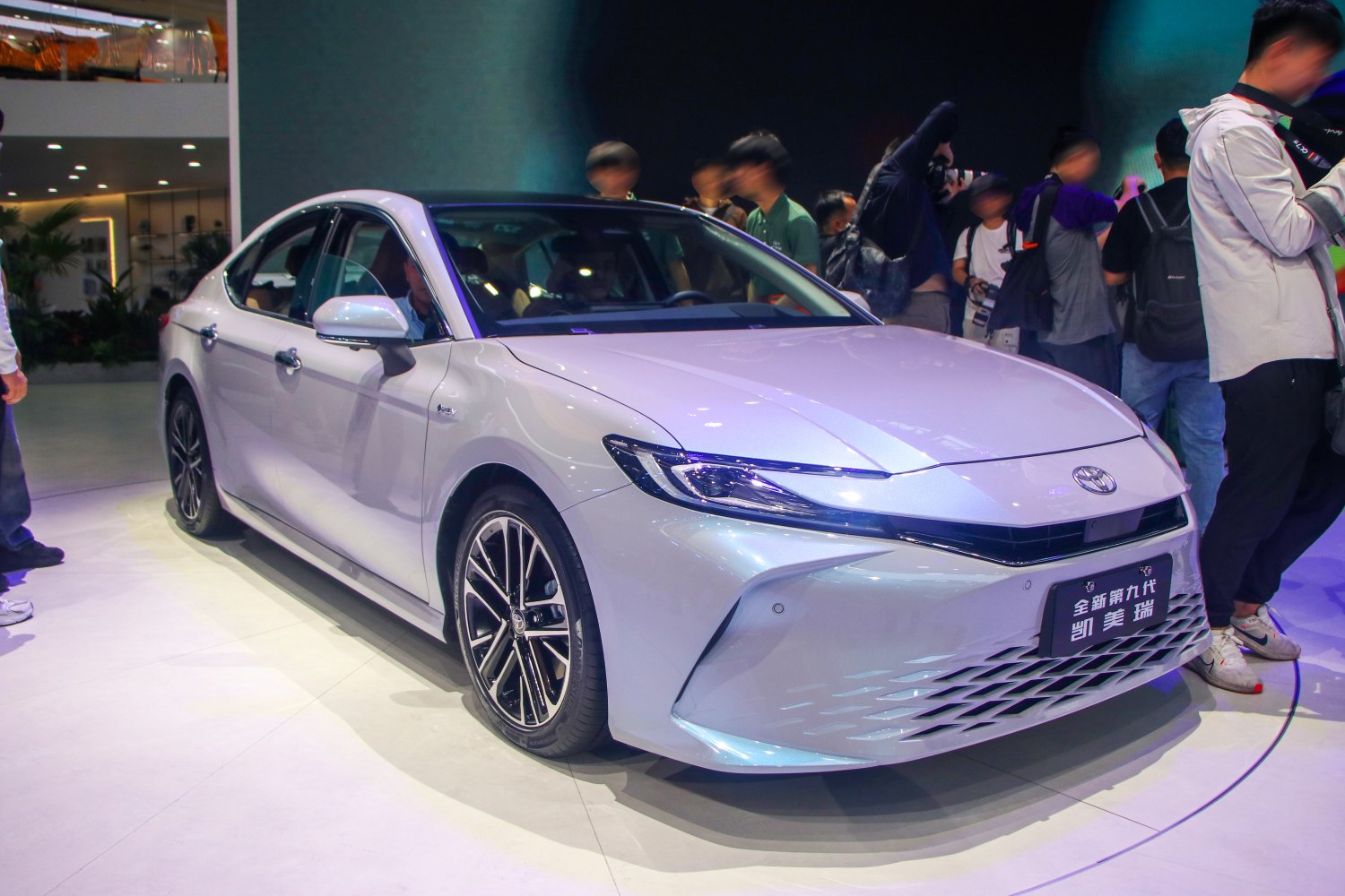Sleek sedan front and side profile with LED headlights and alloy wheels