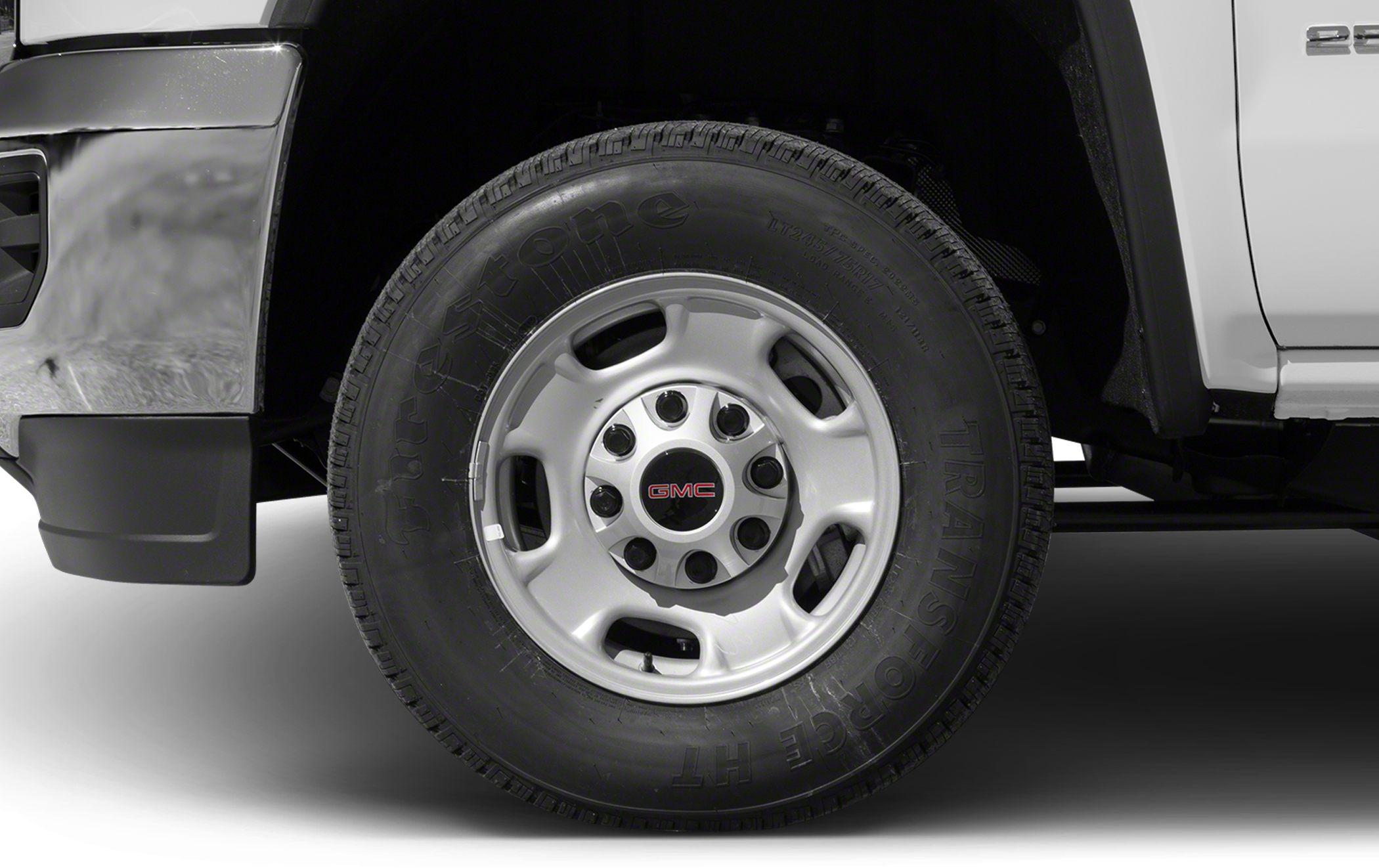 Close-up of a GMC steel wheel with Firestone tire on a heavy-duty truck