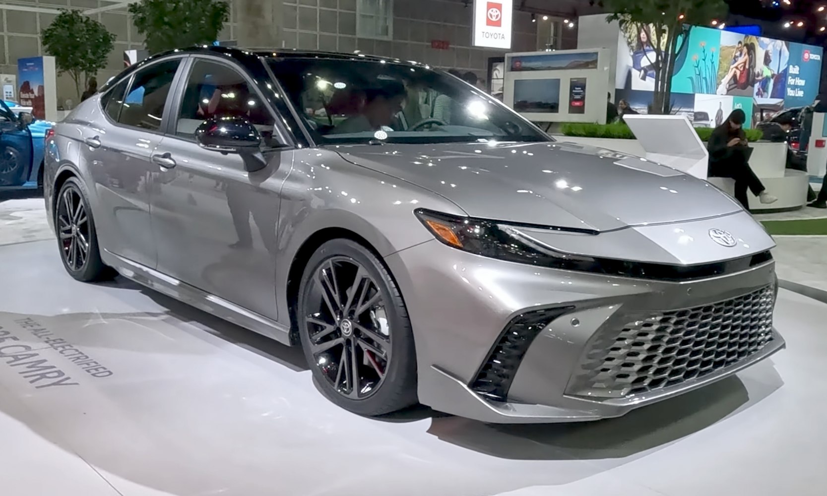 Aerodynamic front fascia with sleek headlights and black alloy wheels