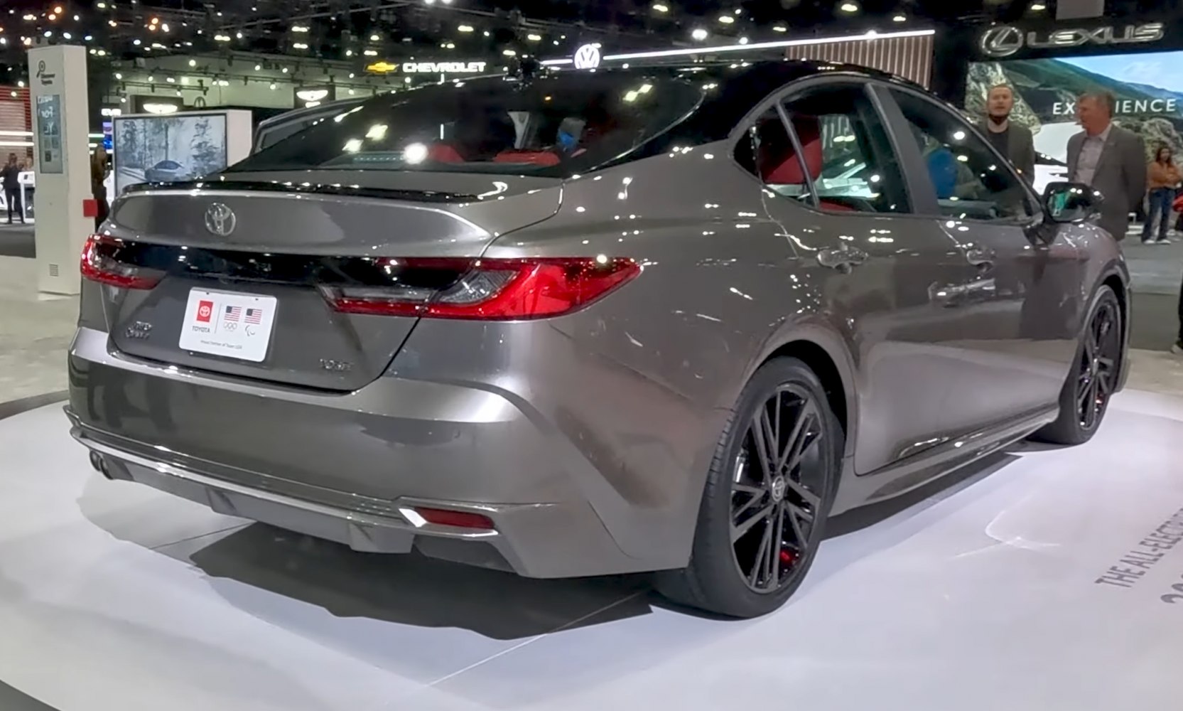 Rear view of a sedan with sleek taillights and black alloy wheels