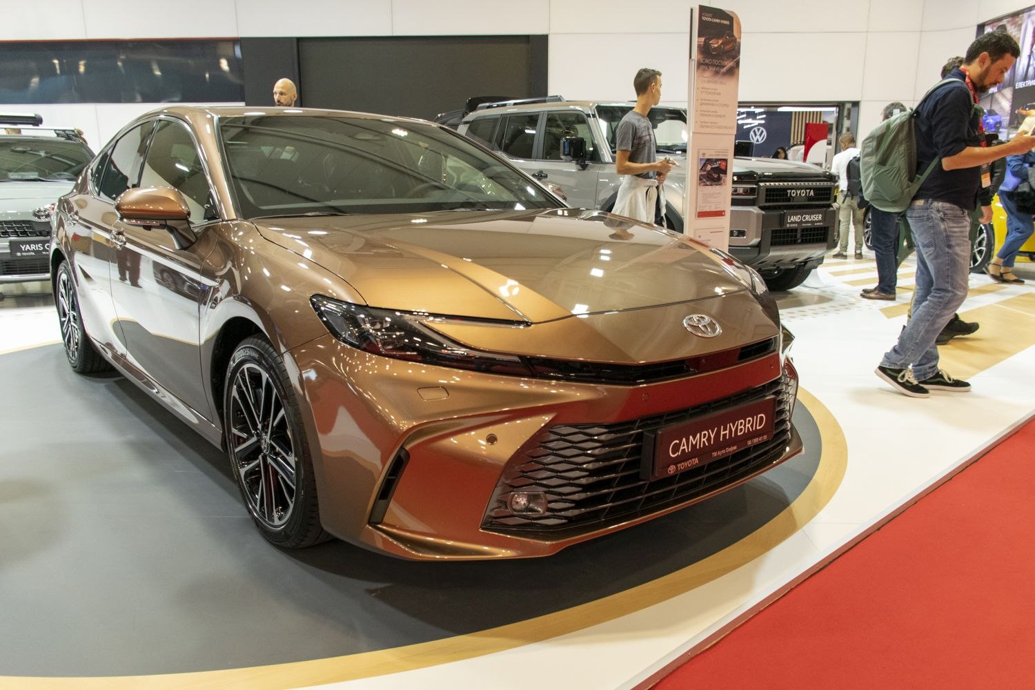 Front view of a sleek, modern hybrid sedan with distinctive headlights and grille.