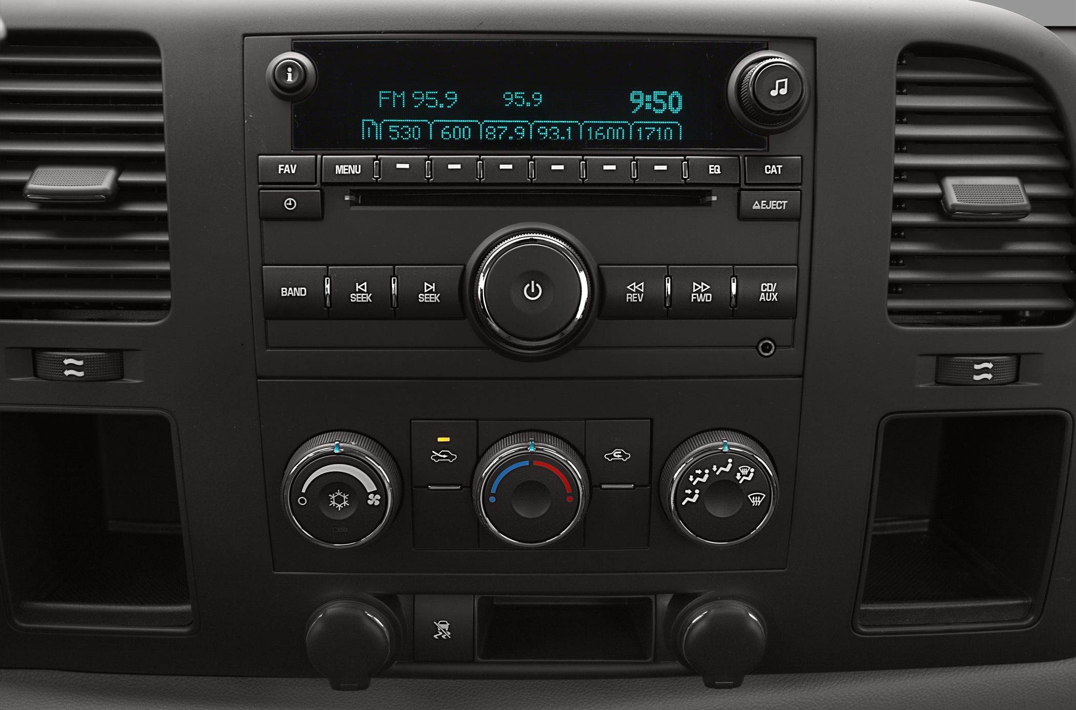 Truck dashboard radio and climate control interface with buttons and dials