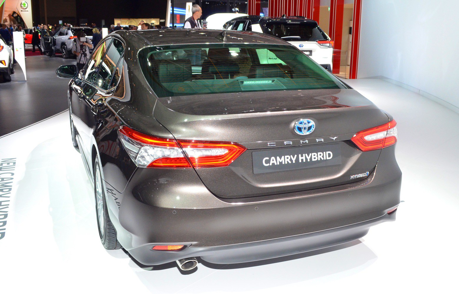 Rear view of a hybrid sedan with distinctive tail lights and trunk design