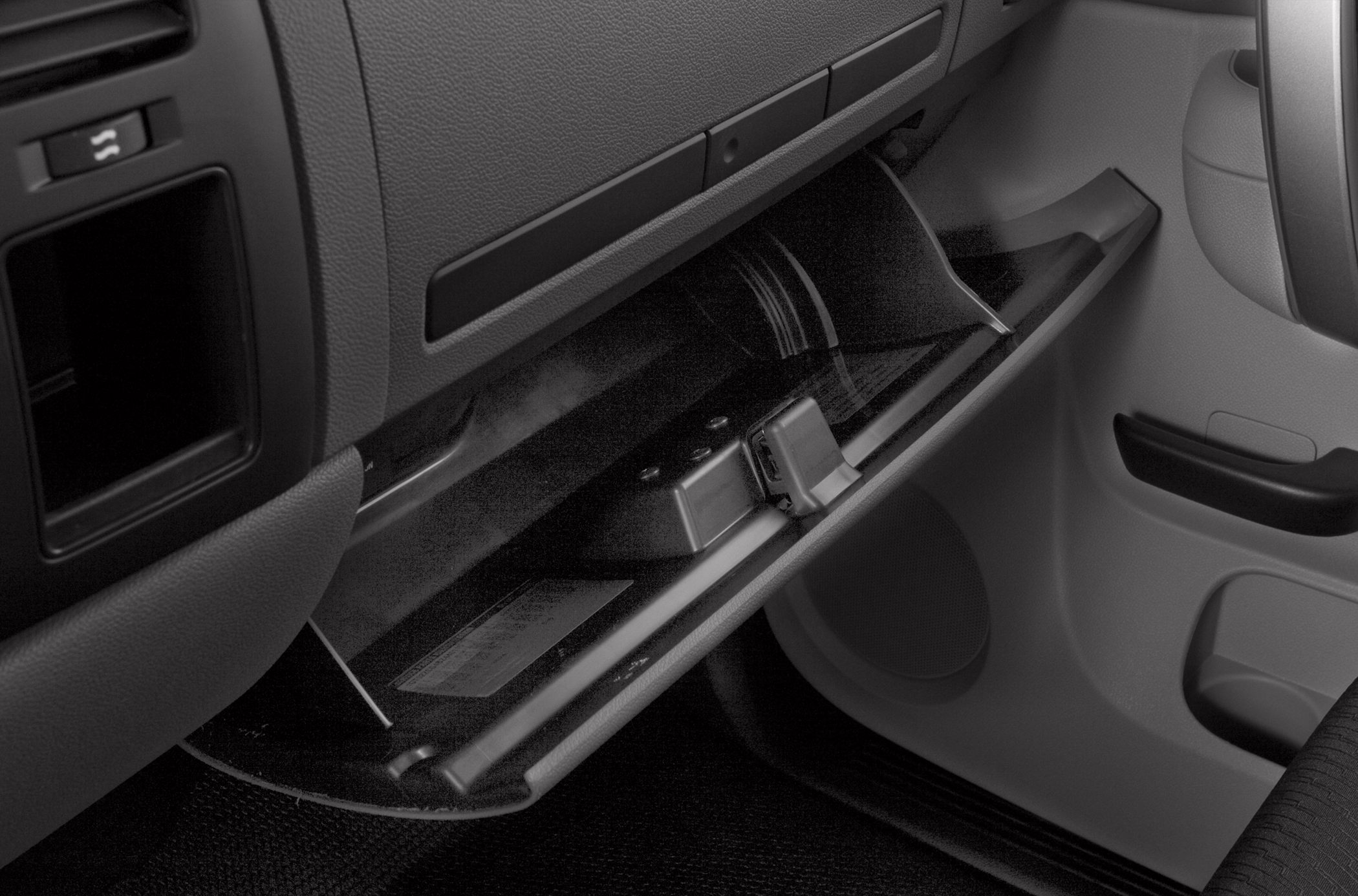 Open glove compartment with textured interior and latch mechanism
