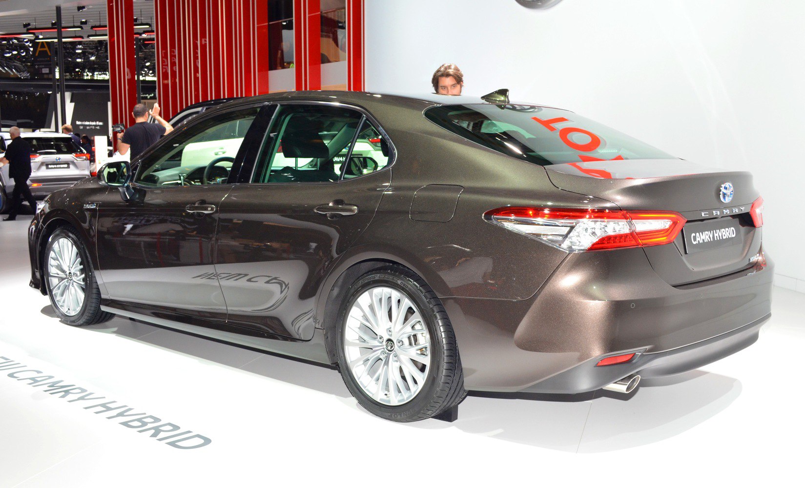 Rear view of a modern mid-size sedan with LED taillights and alloy wheels