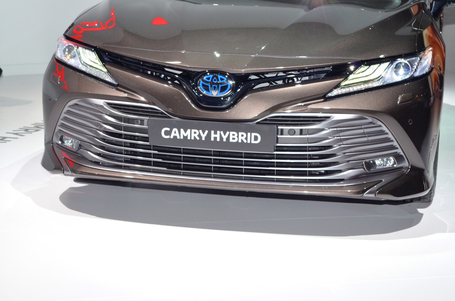 Front grille and LED headlights of a hybrid sedan