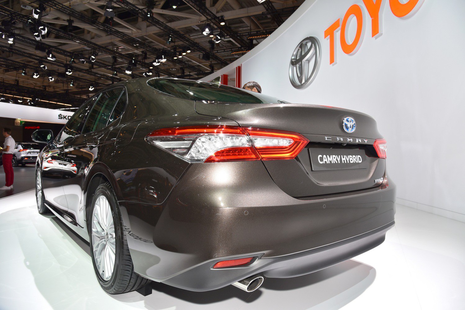 Rear view of a hybrid sedan with sleek tail lights and aero design