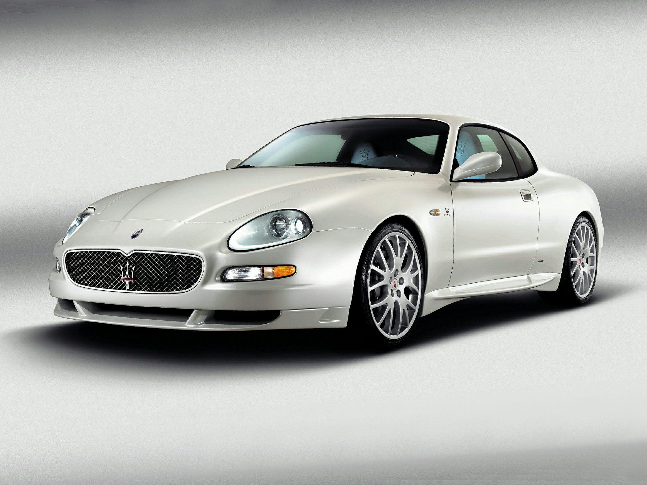 Front view of a luxury sport coupe with distinctive grille and sleek design