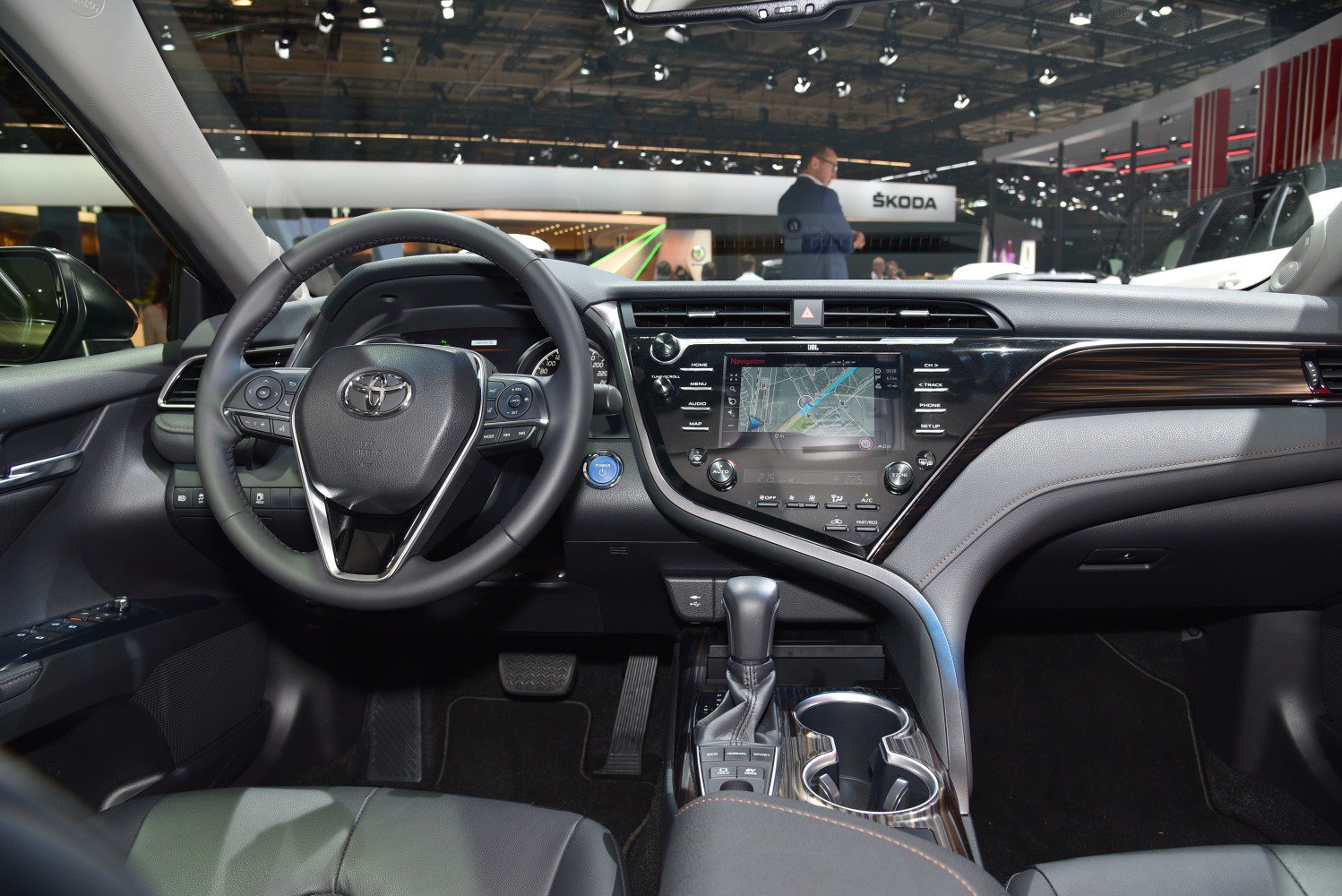 Modern dashboard and steering wheel with touchscreen navigation and gear shift