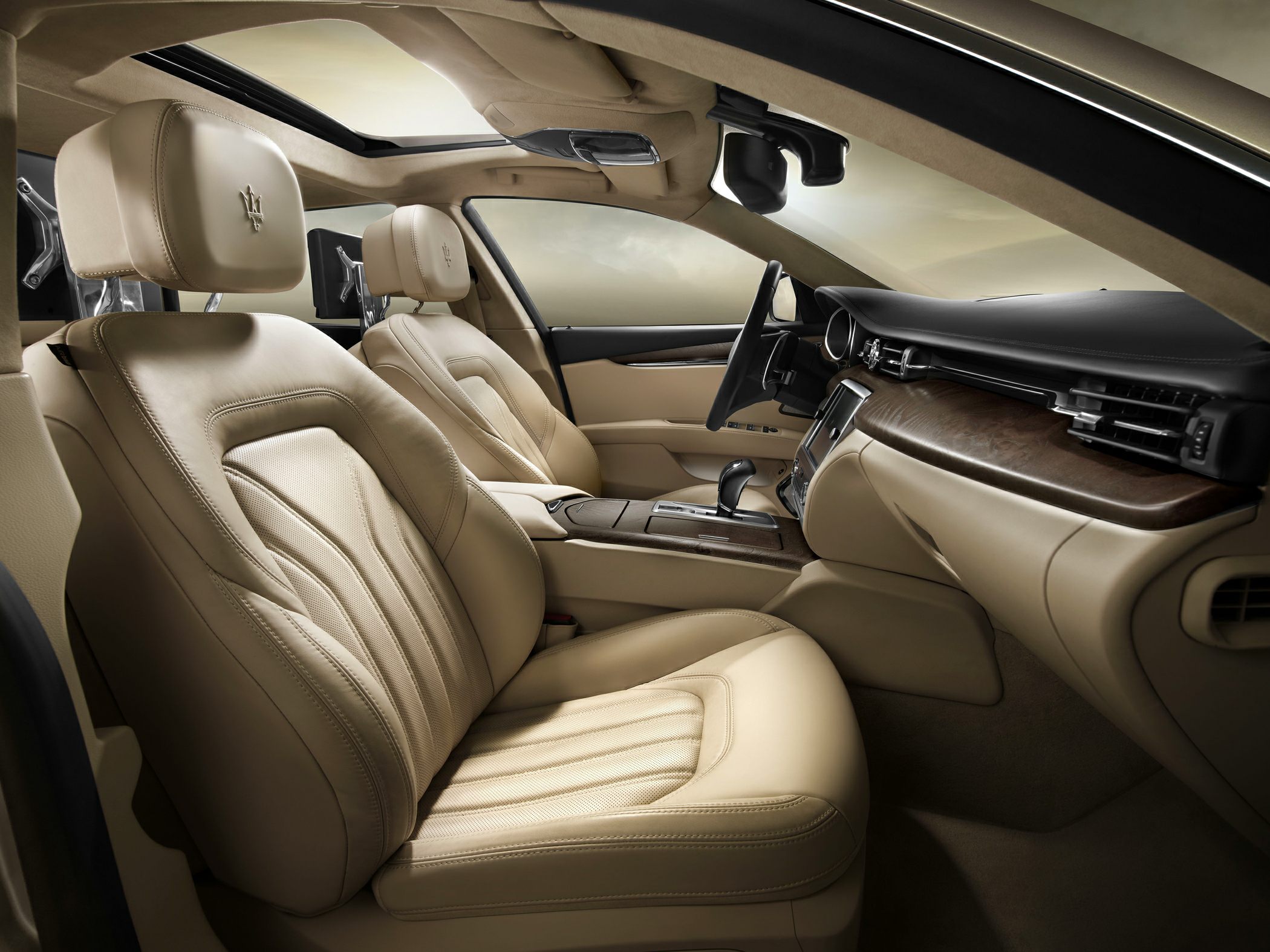 Beige leather luxurious seats with wood trim and panoramic roof