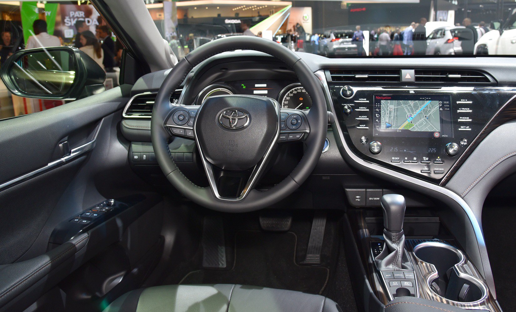 Steering wheel and touchscreen navigation with center console gear shift
