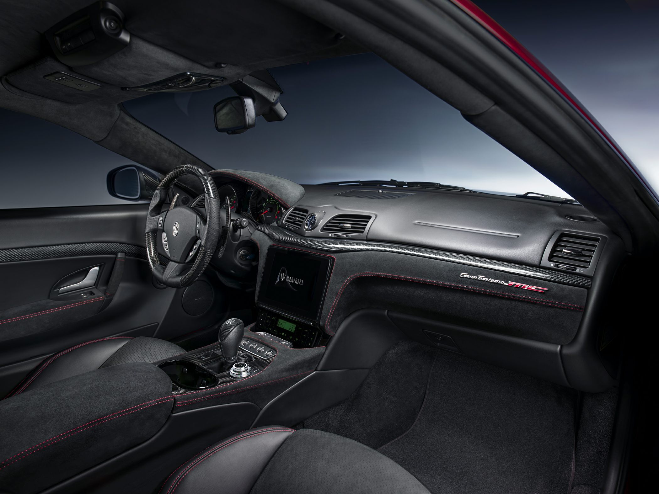 Luxury sports car interior with carbon fiber and Alcantara trim