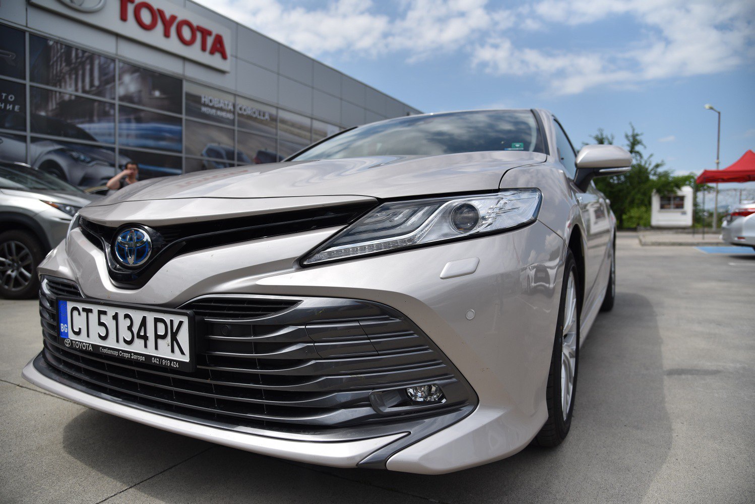 Front view with sleek headlights and prominent grille