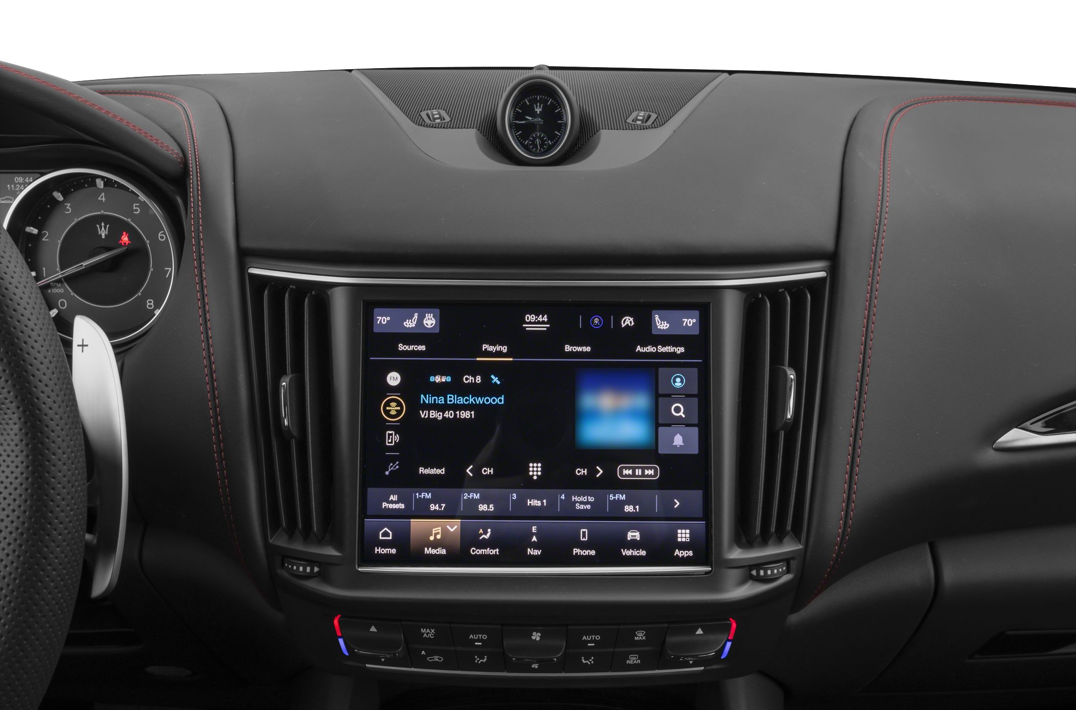Luxury car interior with central touchscreen and analog clock