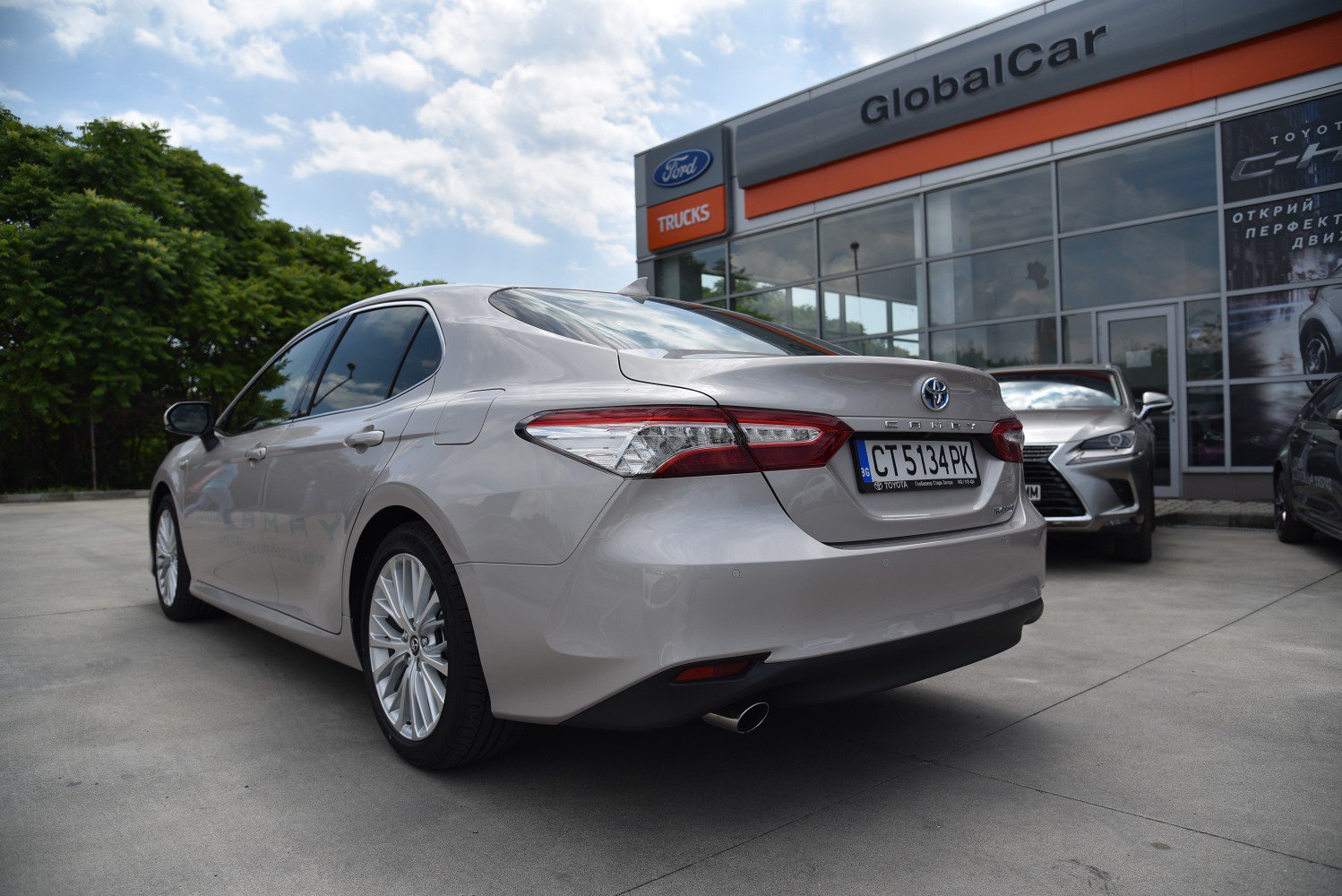 Rear view of a modern sedan emphasizing taillights and rear body design