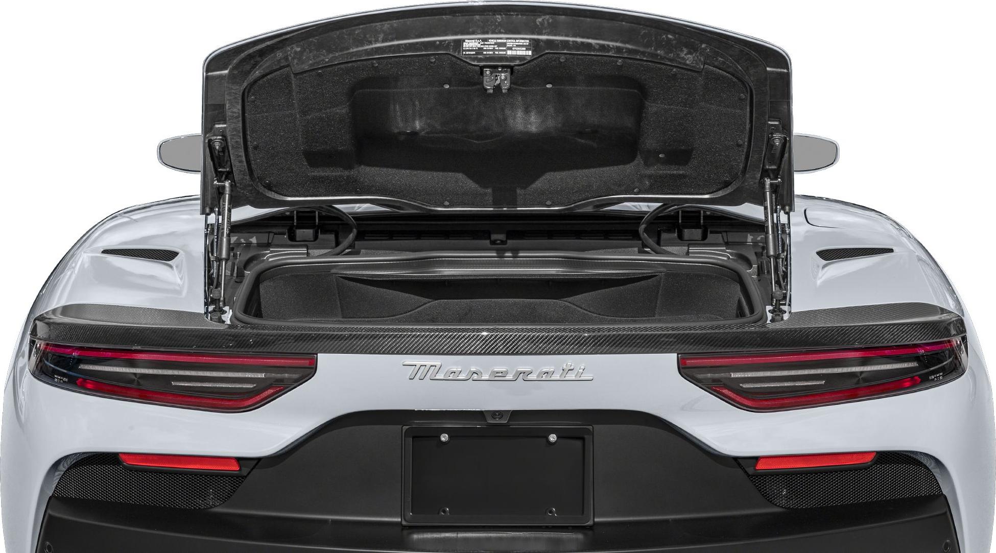 Open rear trunk with visible storage and sleek taillights