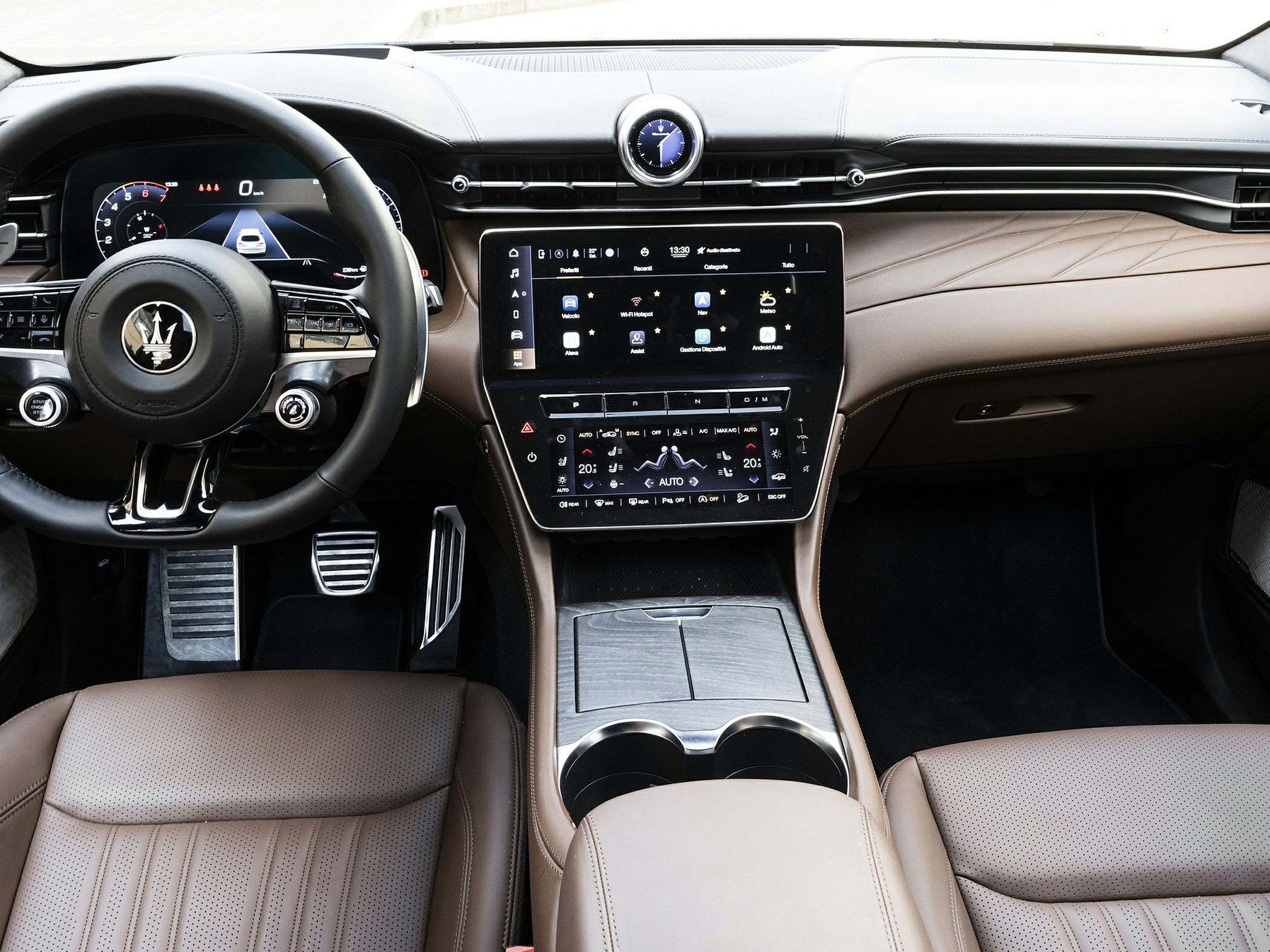 Digital instrument cluster and dual touchscreen infotainment system in luxury SUV interior