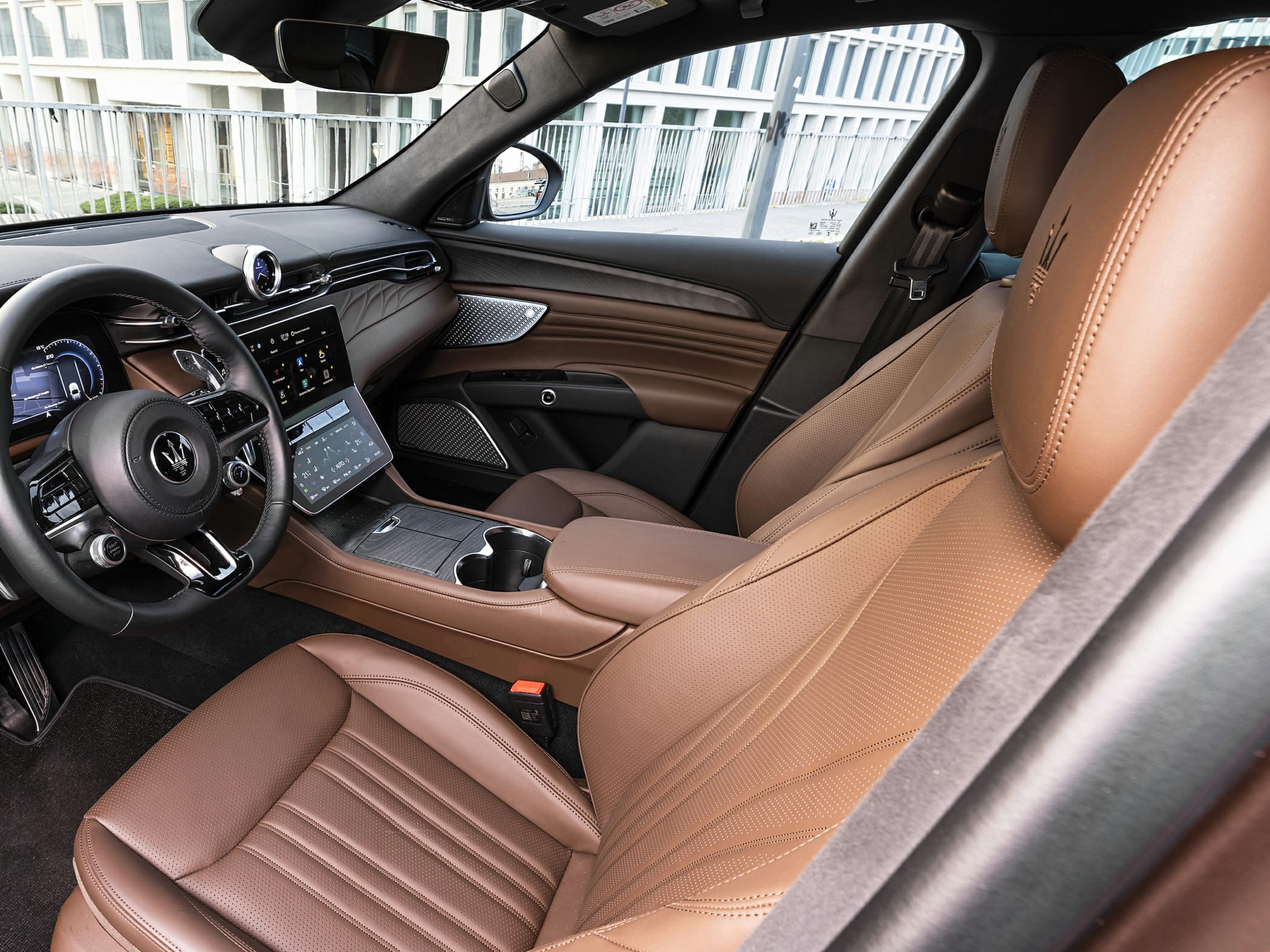 Luxury interior with digital display and brown leather seats