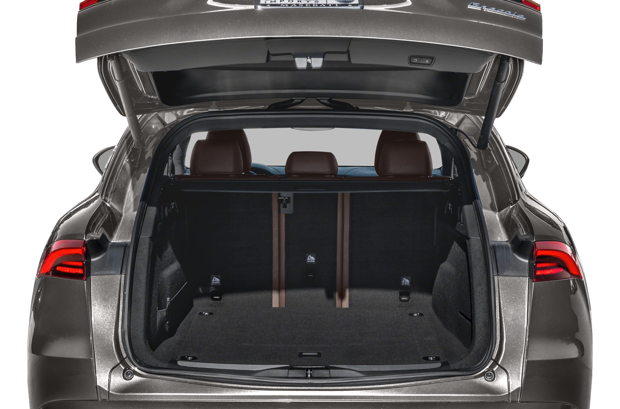 Open rear trunk with spacious cargo area and rear seats