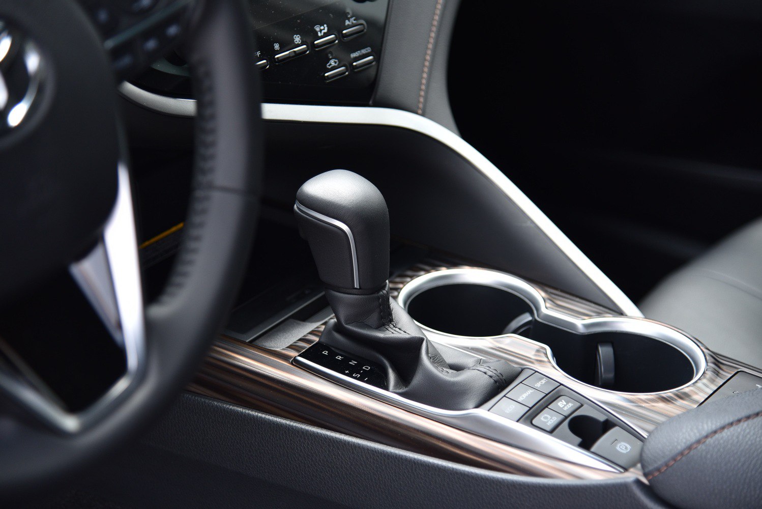 Automatic gear shift lever and multifunction control buttons on center console