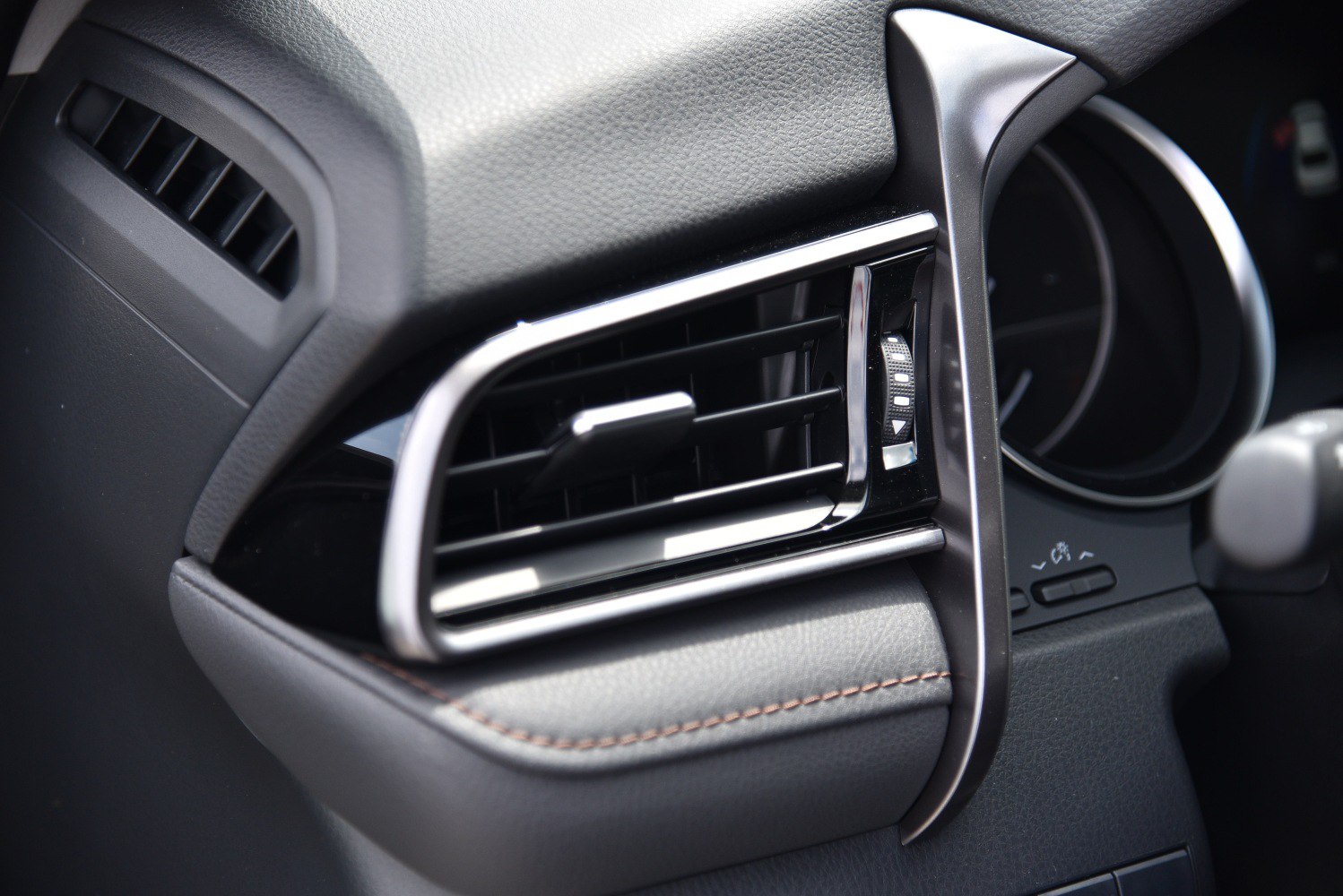 Close-up of car interior air vent and dashboard details
