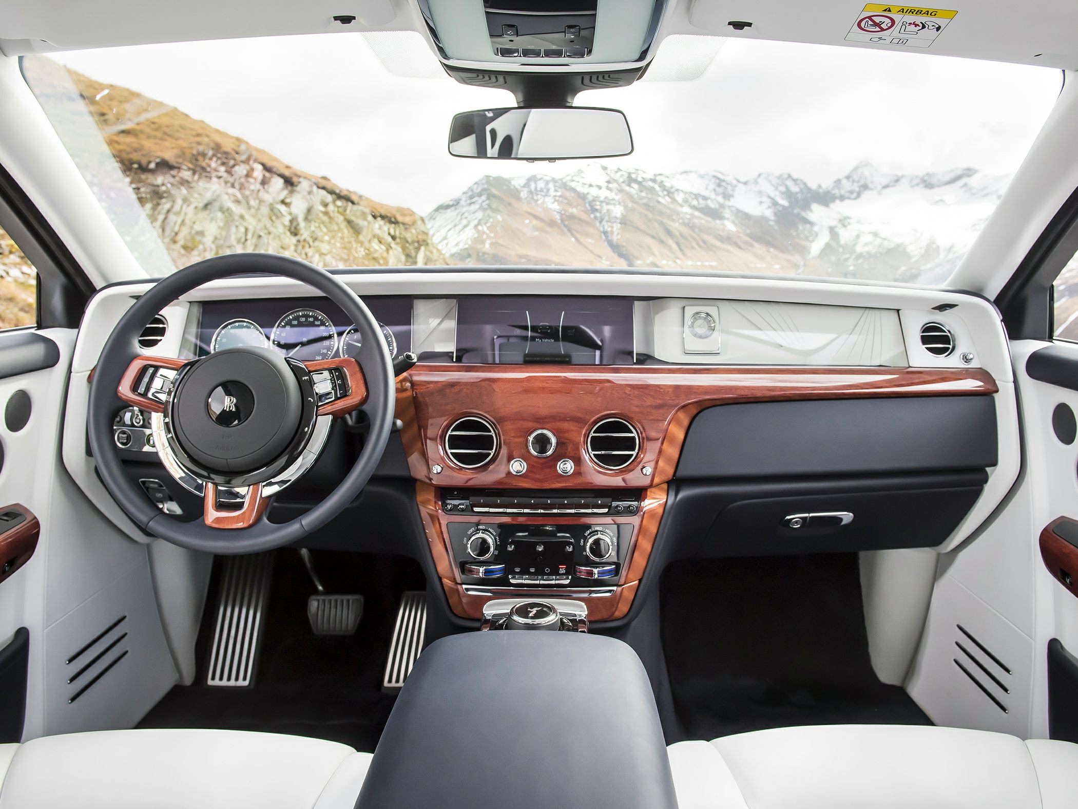 Luxury wood-trimmed dashboard with advanced steering wheel controls