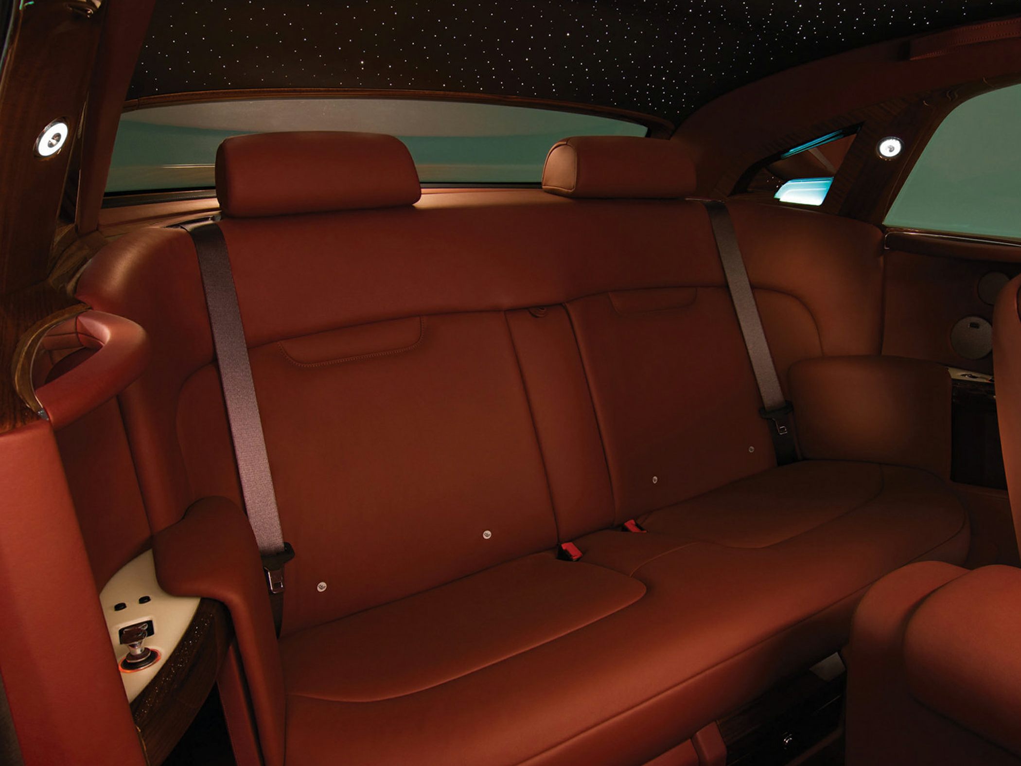 Luxurious brown leather rear seats with ambient star roof lighting