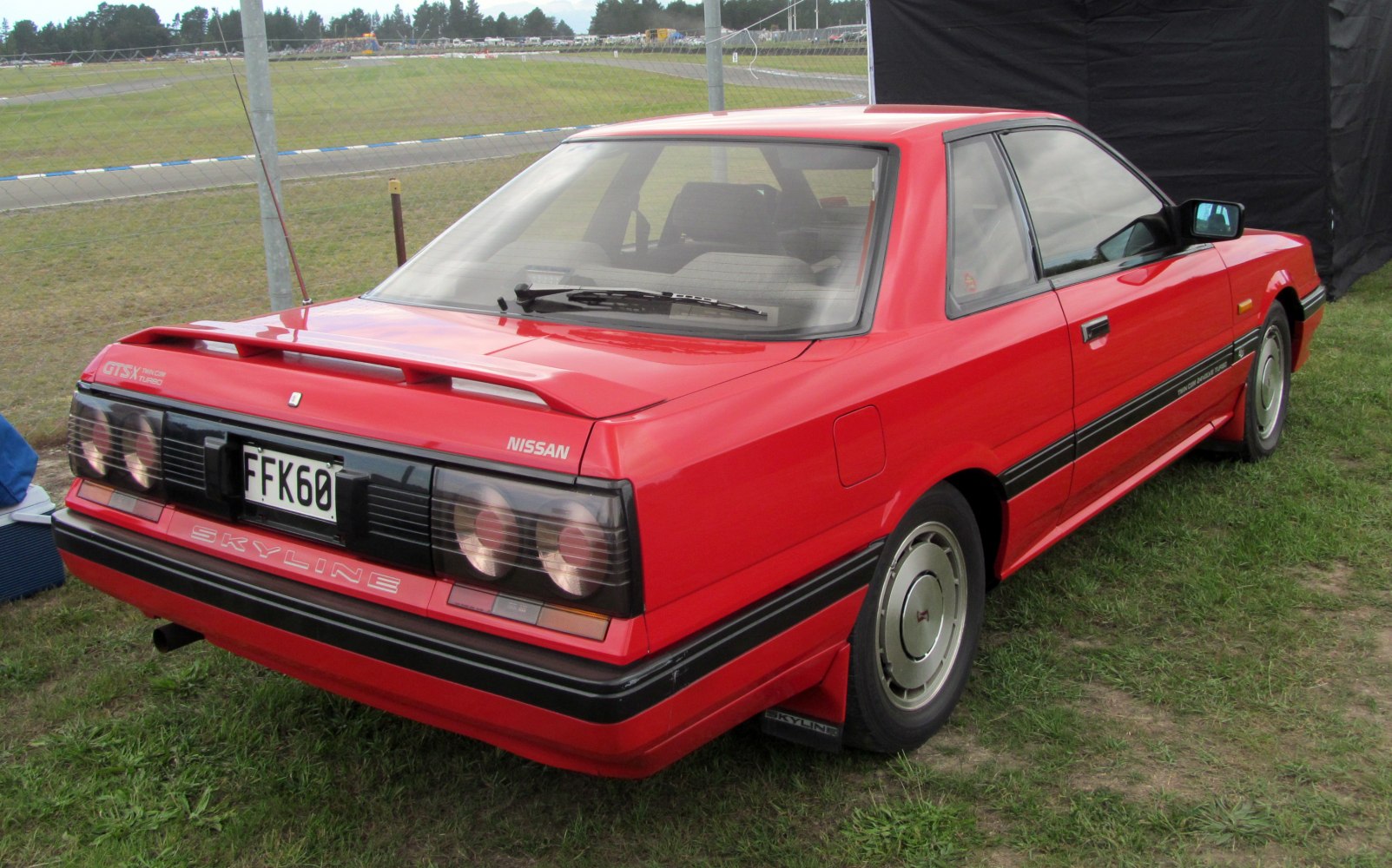 Rear view with quad round tail lights and rear spoiler