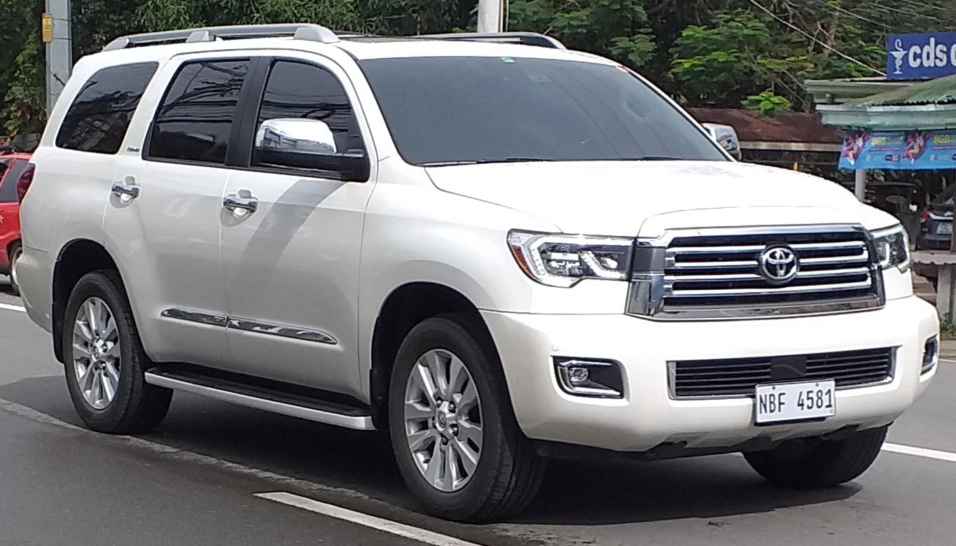 White full-size SUV with chrome grille and alloy wheels
