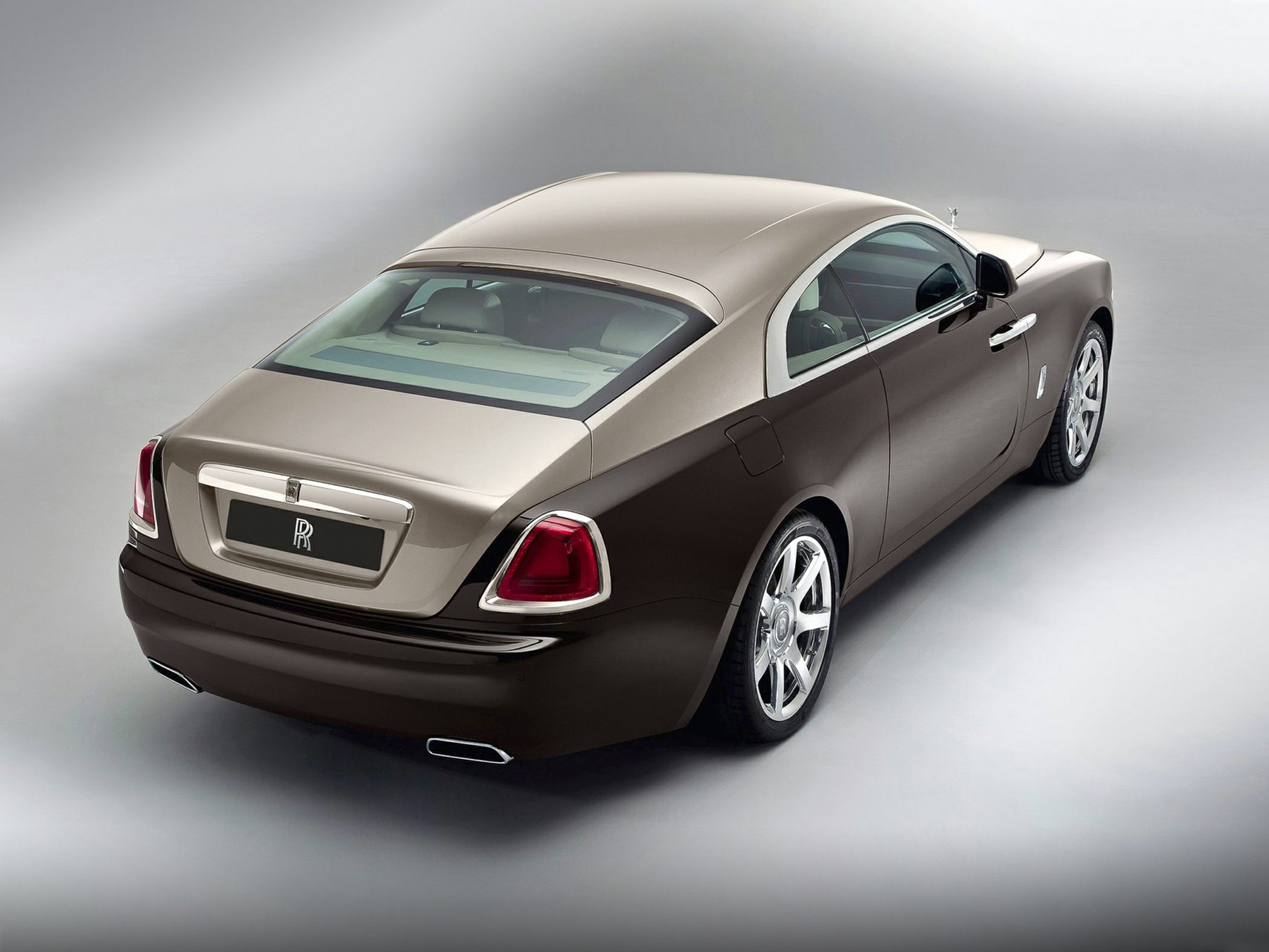 Luxury coupe rear view with distinctive taillights and dual exhaust