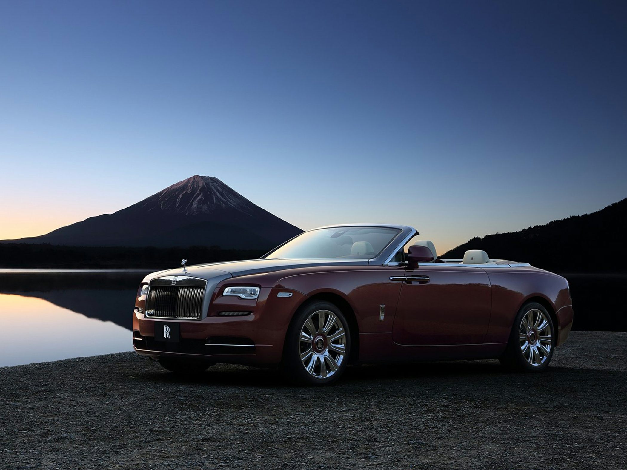 Luxury convertible roadster with chrome grille and elegant design