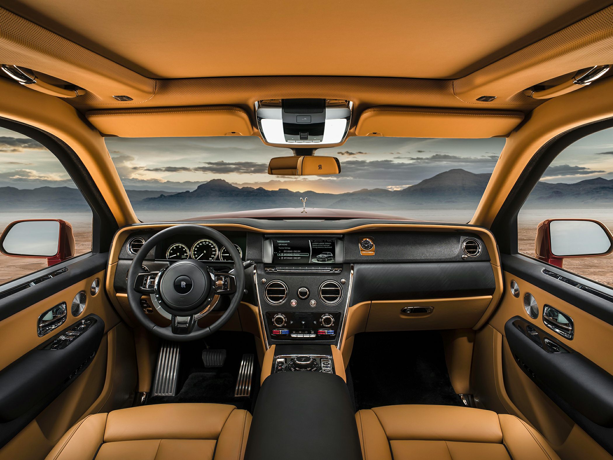 Tan leather interior with advanced dashboard and steering wheel