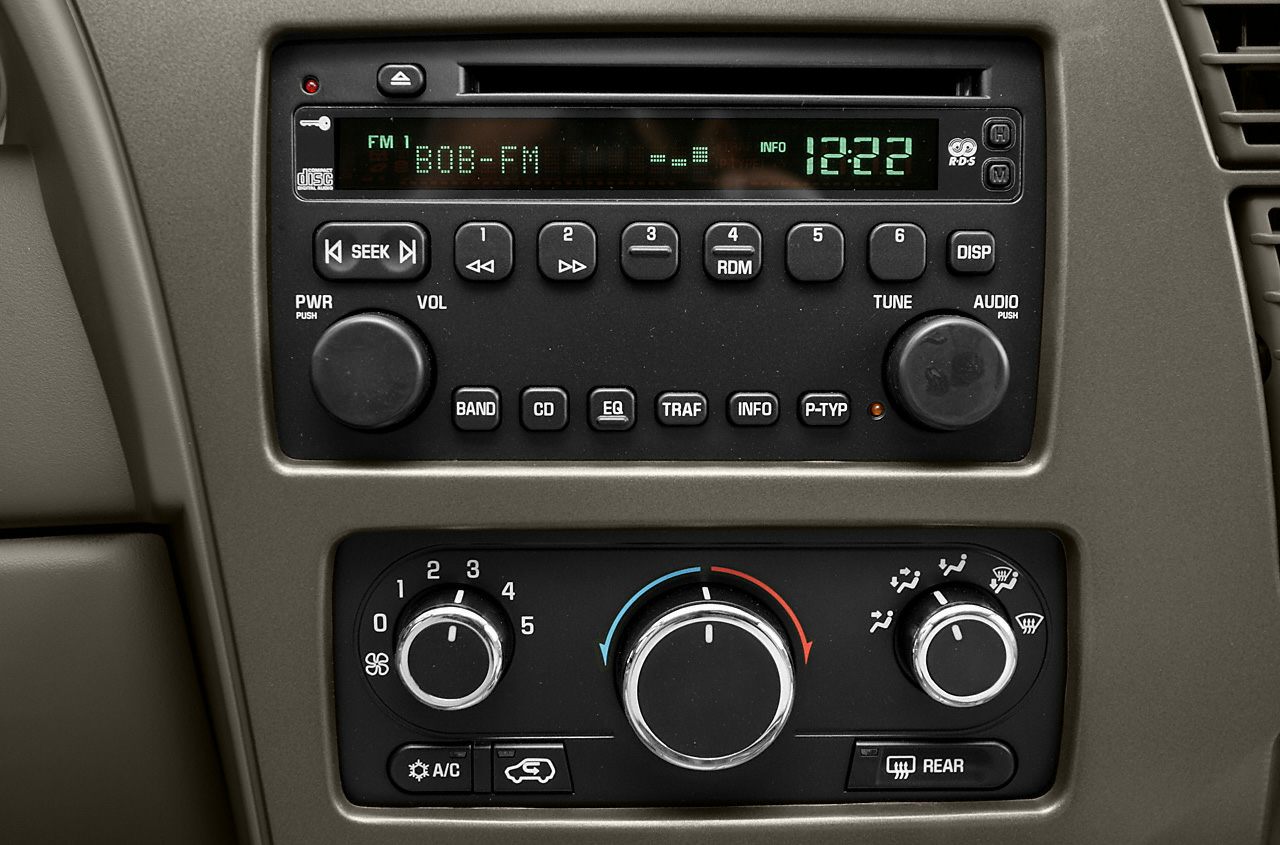 Classic car audio system and climate control panel with knobs and buttons