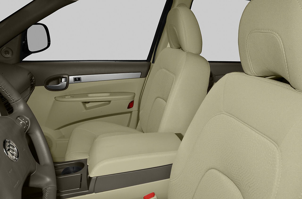 Beige upholstery front seats with armrest and door panel with chrome accent