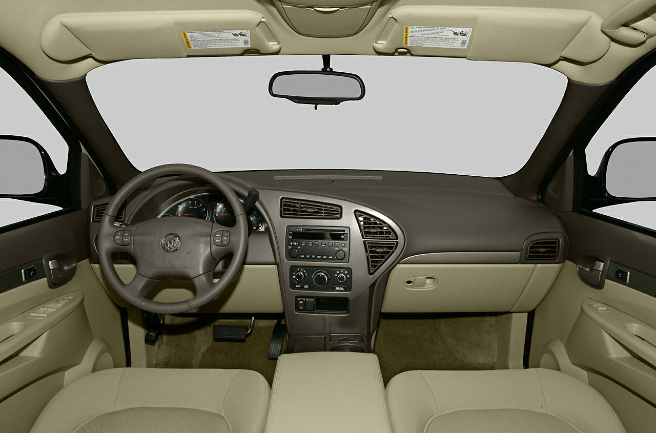 Beige interior with dashboard, steering wheel, and center console.