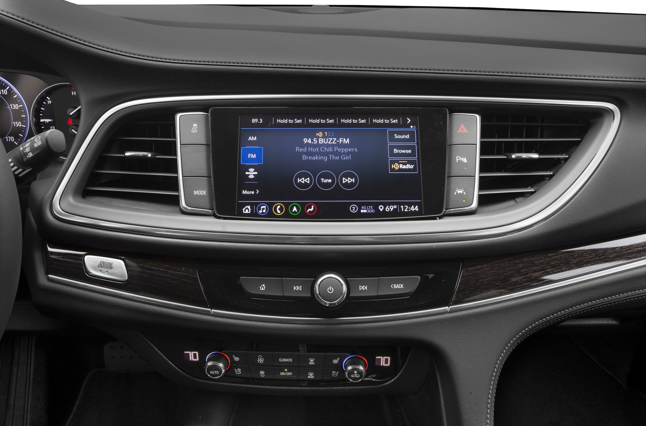 Infotainment touchscreen and dual-zone climate controls in mid-size SUV interior