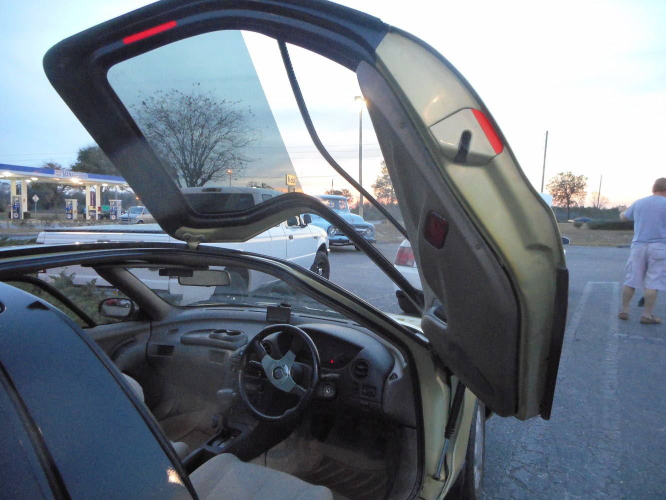 Upward opening gullwing-style door with interior view