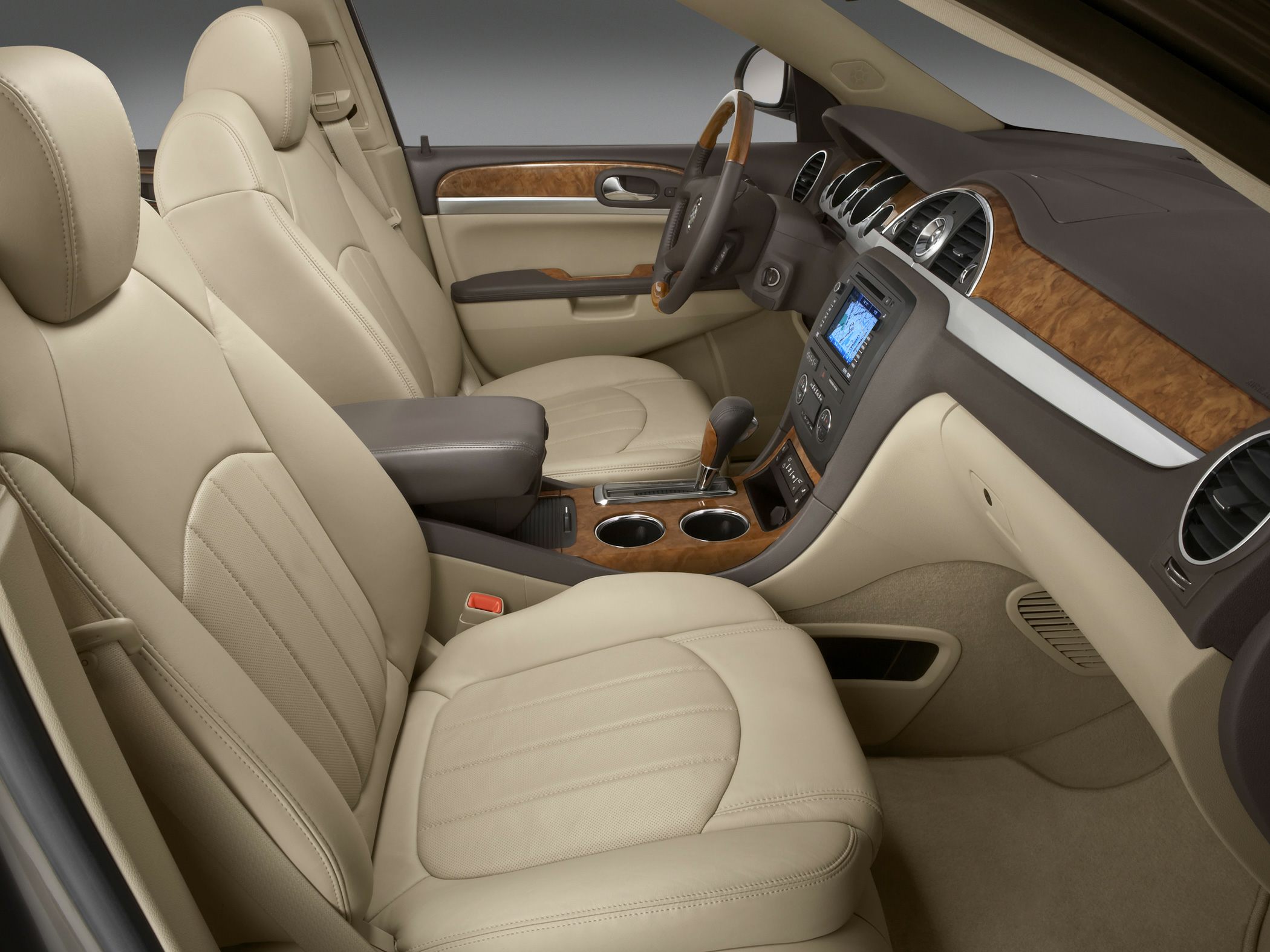 Beige leather seats with wood trim dashboard and navigation system