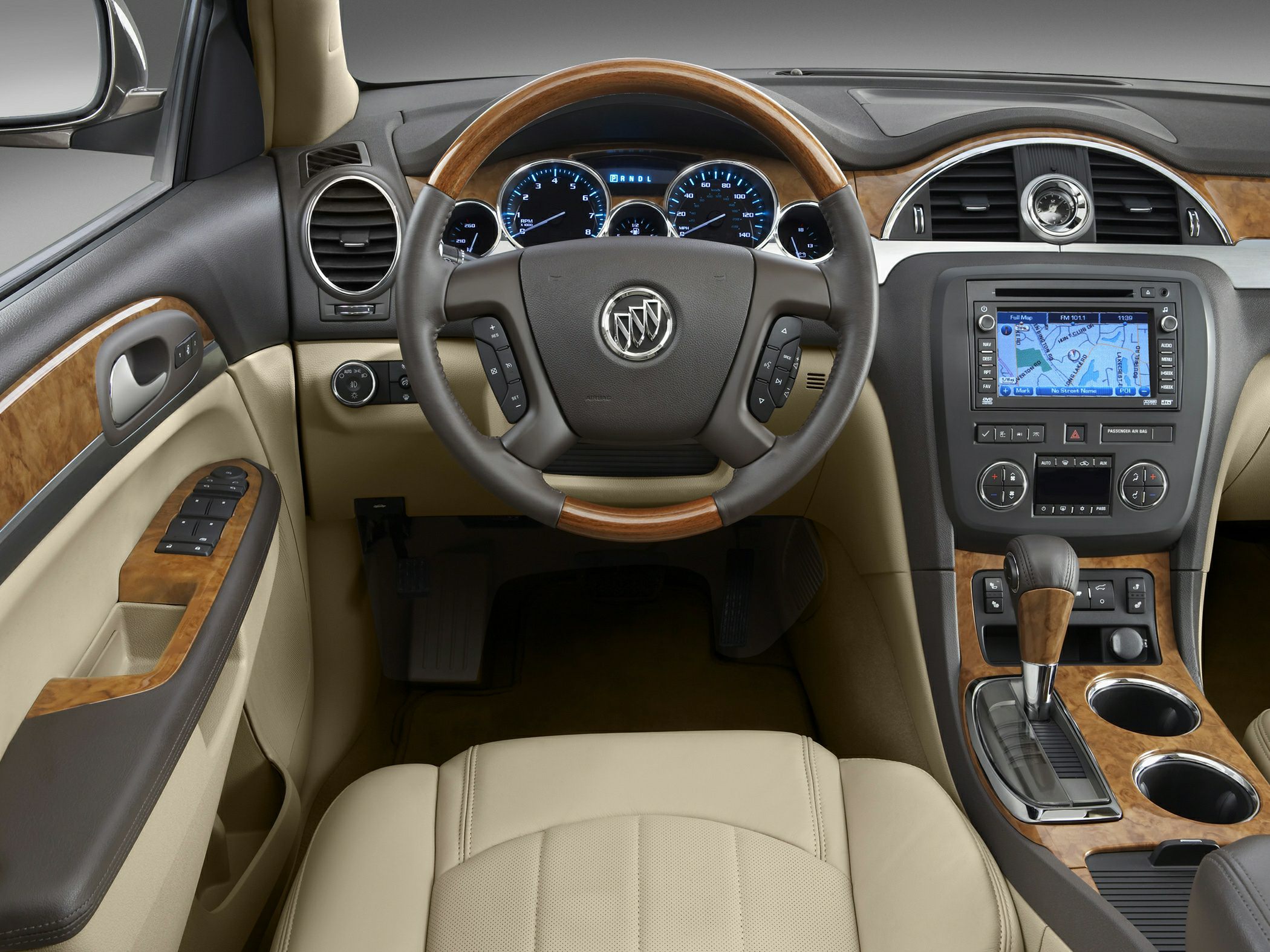 Wood grain trim steering wheel and dashboard with navigation system and digital instruments