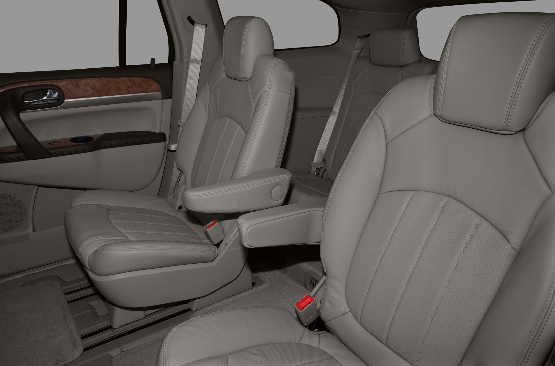 Leather captain seats with armrests and wood trim door panel