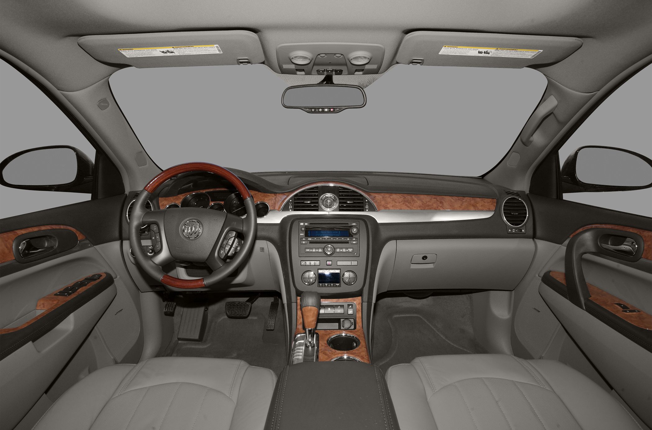 SUV interior with wood trim and steering wheel controls