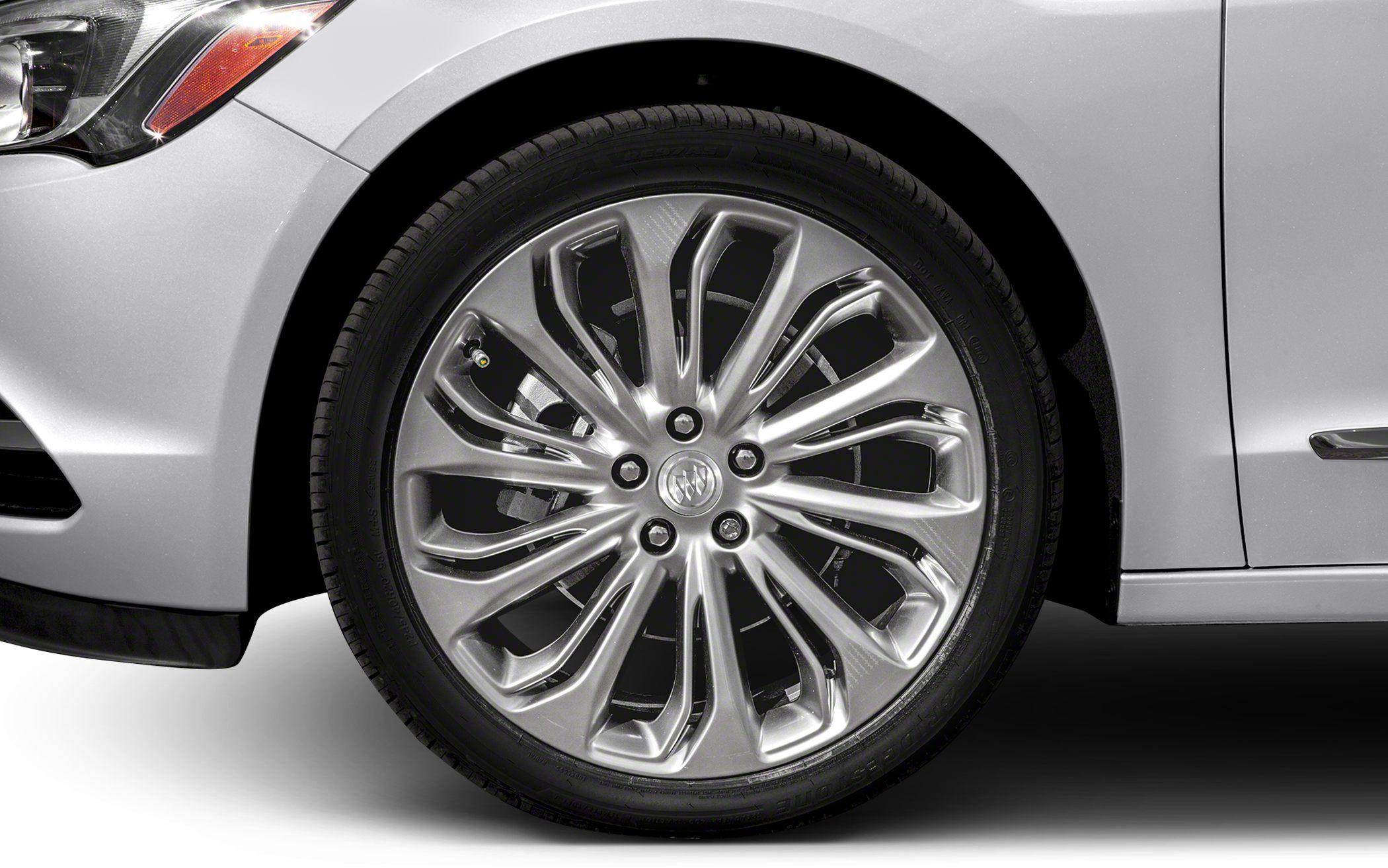 Close-up of a multi-spoke alloy wheel on a car front side.