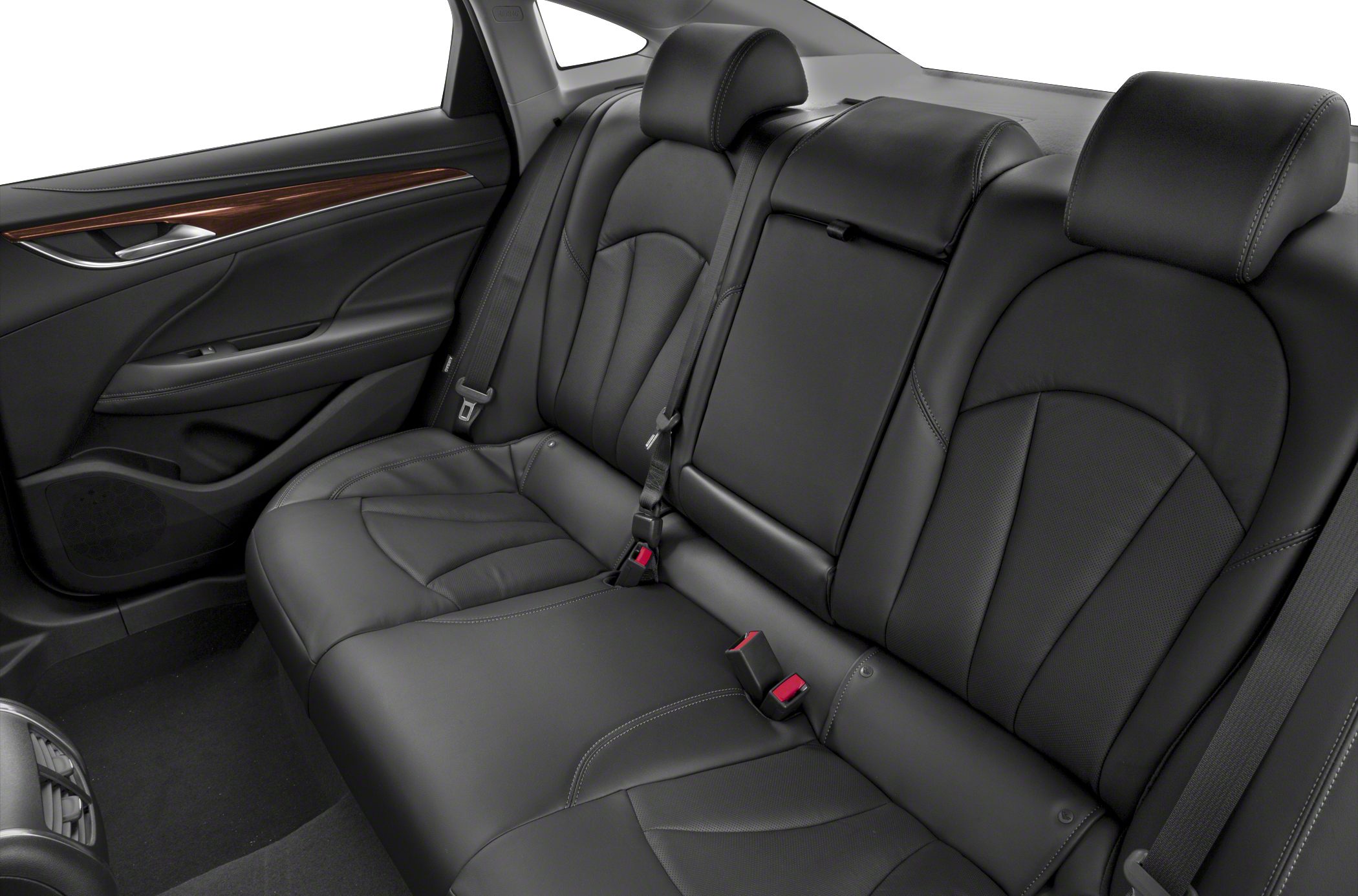 Black leather rear seat with stitching and wood trim on door panel