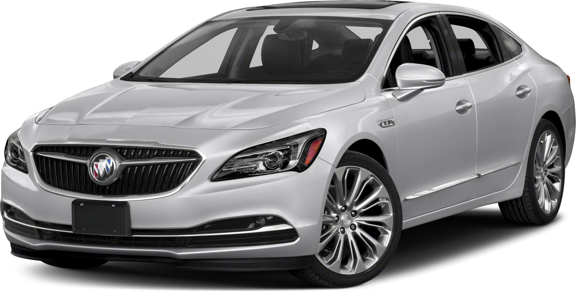 Silver sedan with prominent front grille, modern headlights, and multi-spoke alloy wheels
