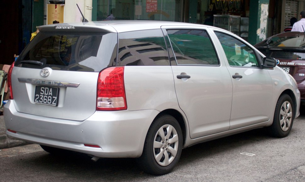 Rear view of a five-door vehicle with distinctive tail lights and roof spoiler