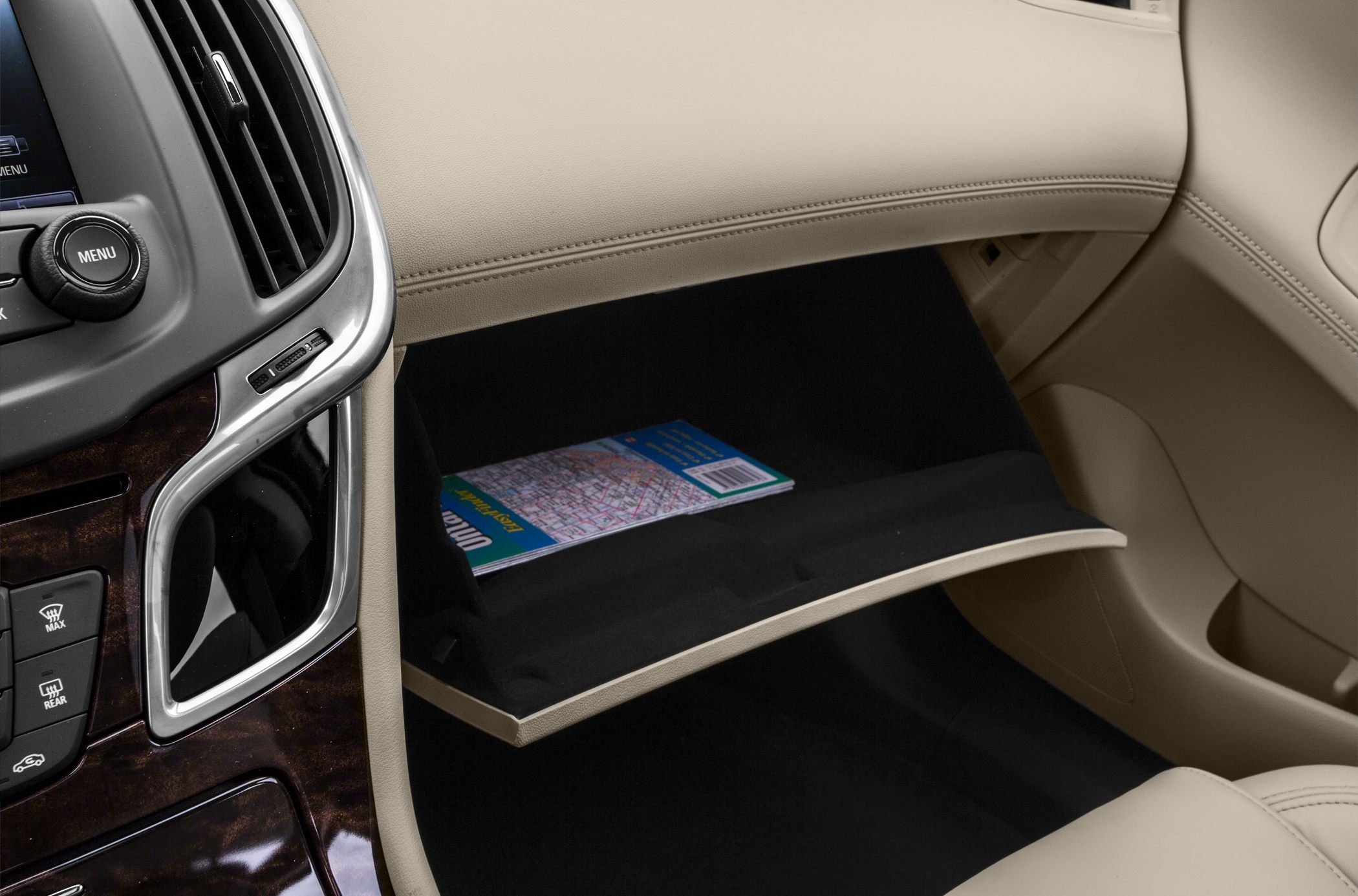 Beige leather interior with open glovebox showing storage space